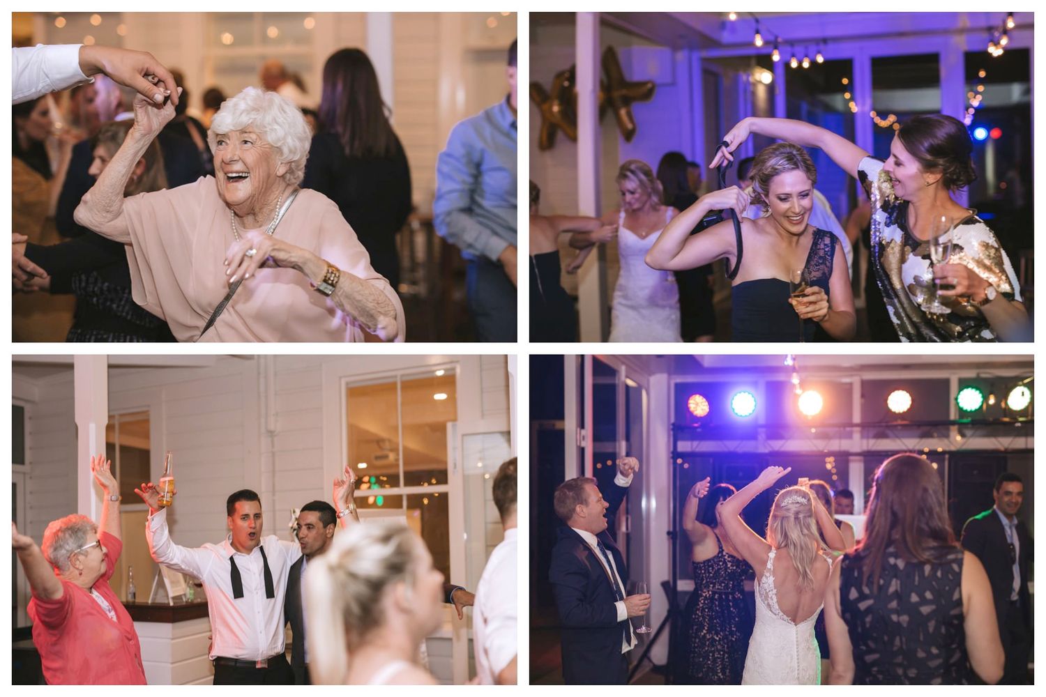 Wedding guests dancing together on a festive dance floor with purple lighting and lively atmosphere.