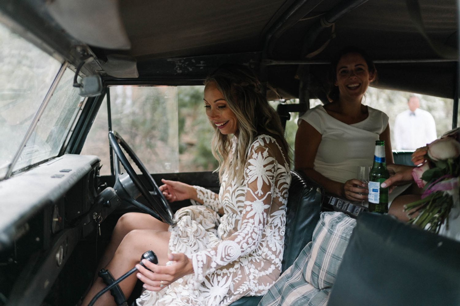 A person wearing a white lace top sits in the driver's seat of a car, captured from multiple angles.