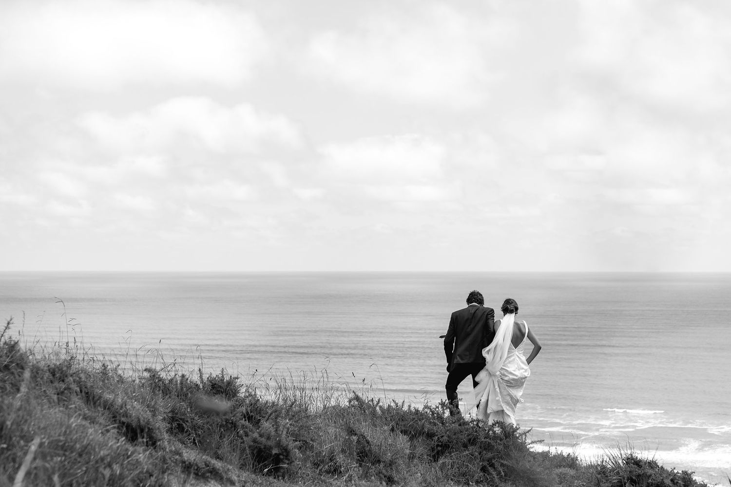 Scenic panoramic sequence of rugged coastal landscape with dramatic cliffs overlooking the ocean under cloudy skies.