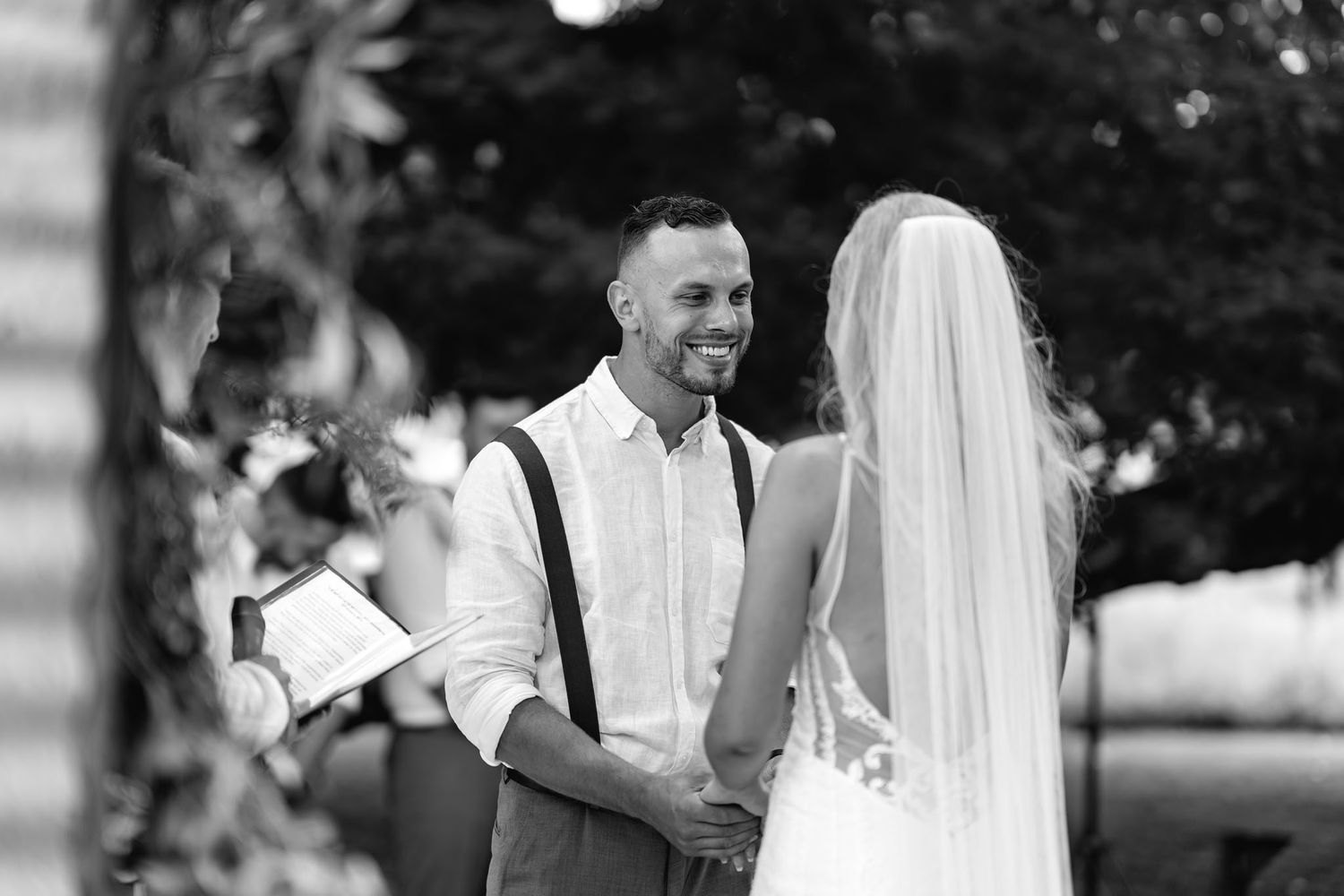 Joyful bride and groom share intimate moments and dance together during their wedding celebration outdoors.