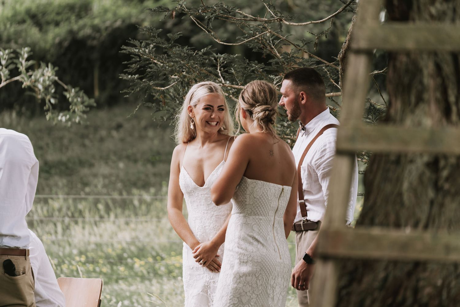 Newlywed couple shares an intimate moment during their outdoor garden wedding reception.