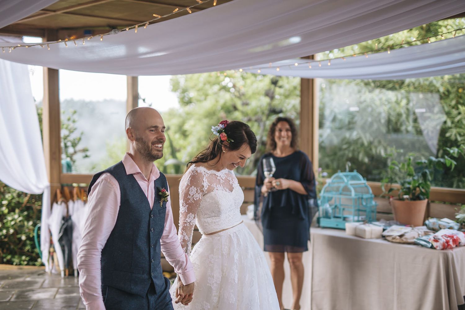 A series of champagne toasts and celebratory wedding moments under a white tent at an outdoor reception.