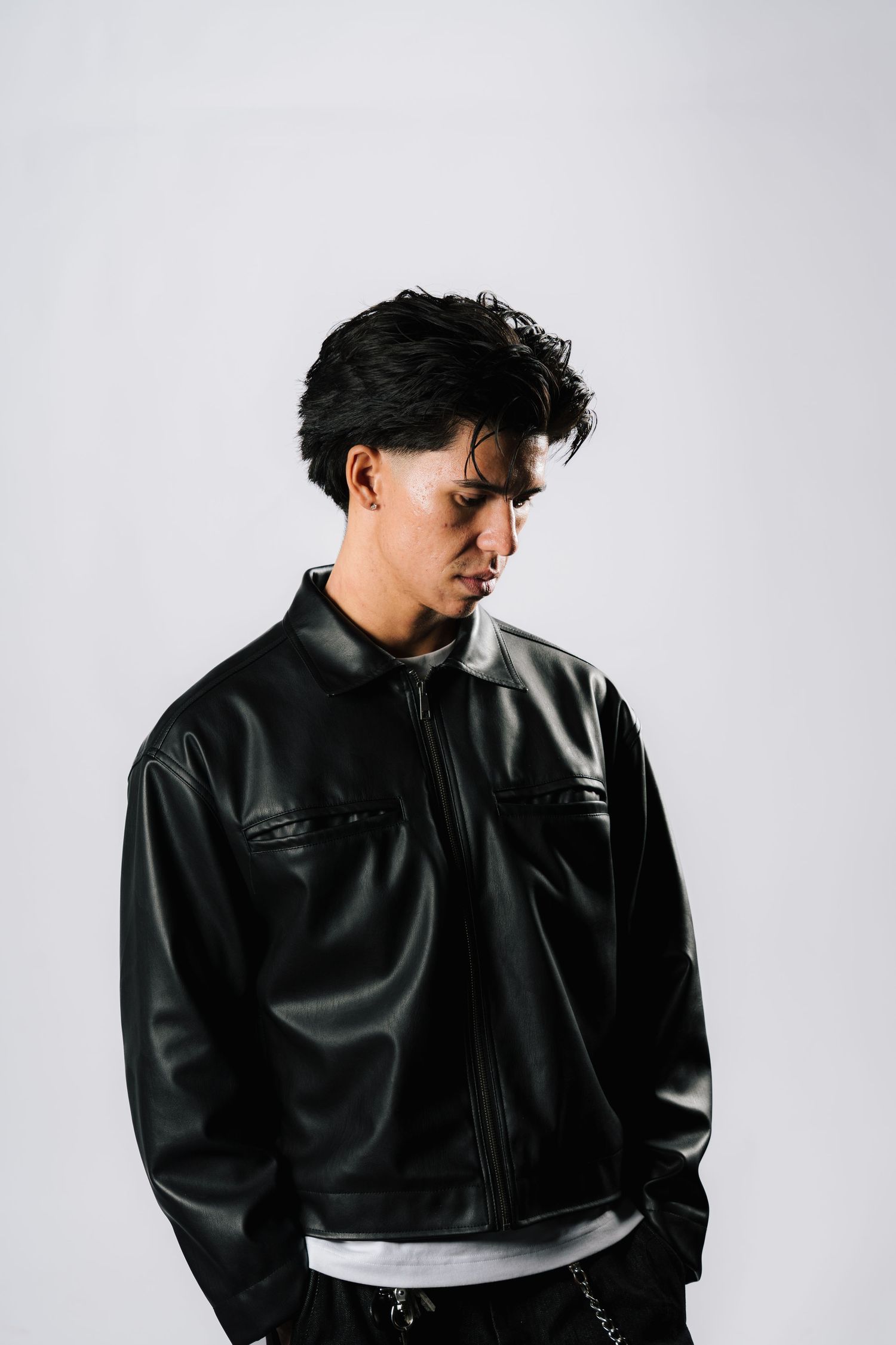 Studio portrait series showing a person in black leather jacket against white background.