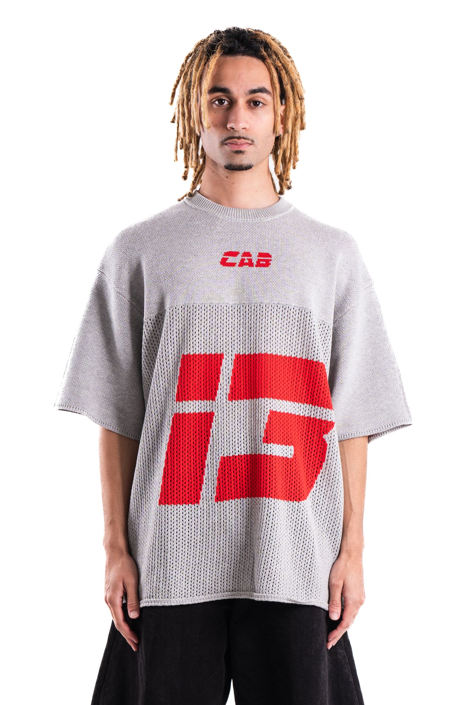 Grey oversized t-shirt with red graphic design and text.