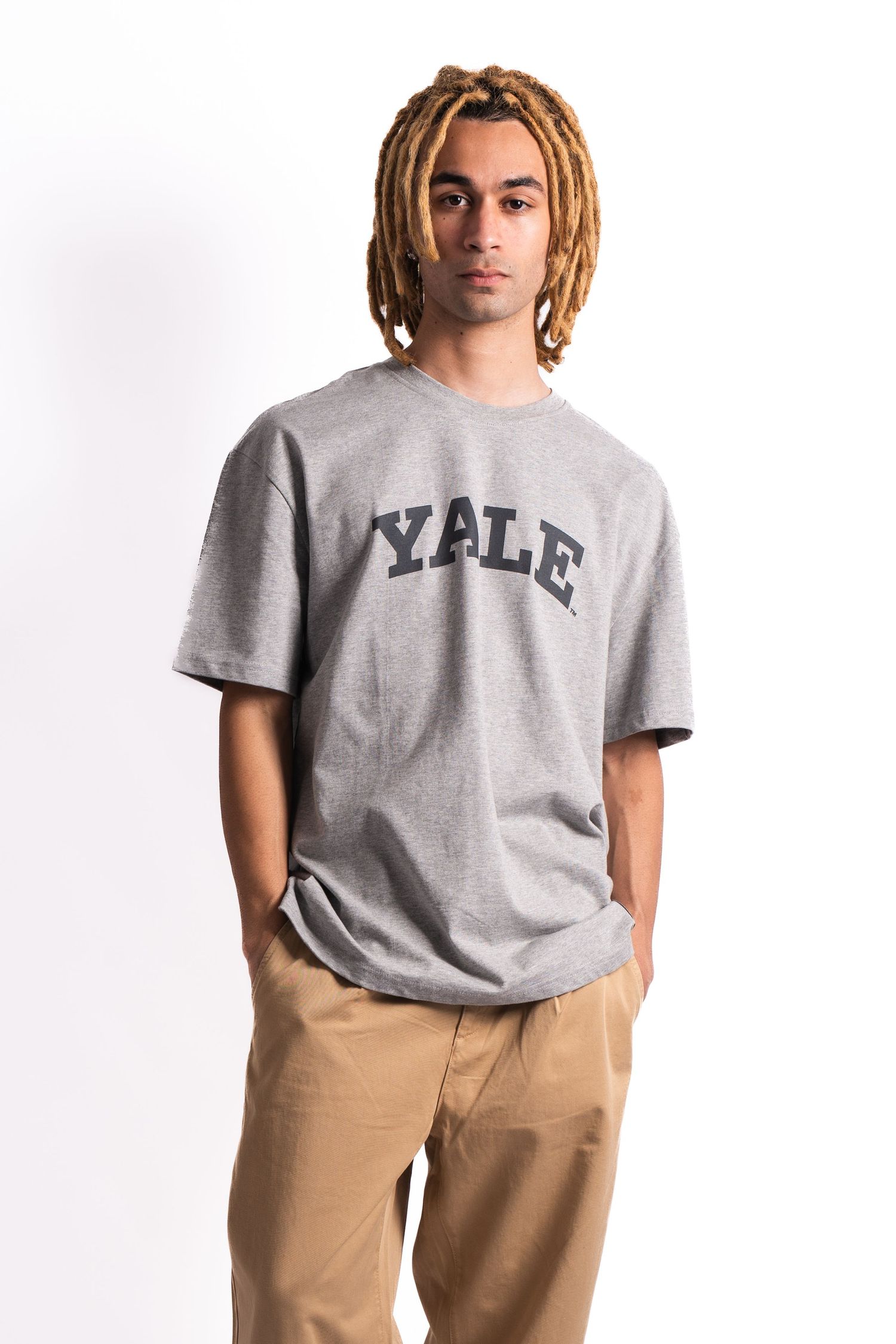 Grey t-shirt with Yale university text logo and khaki pants on display.