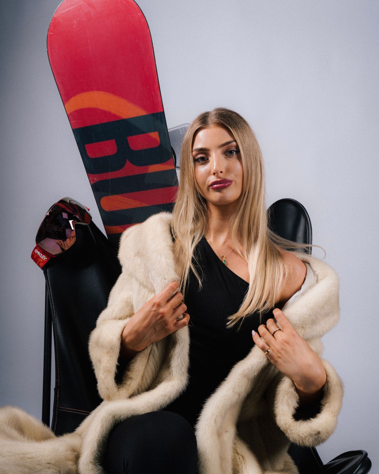 Stylish red and black thigh-high fashion boots with side zipper detail.