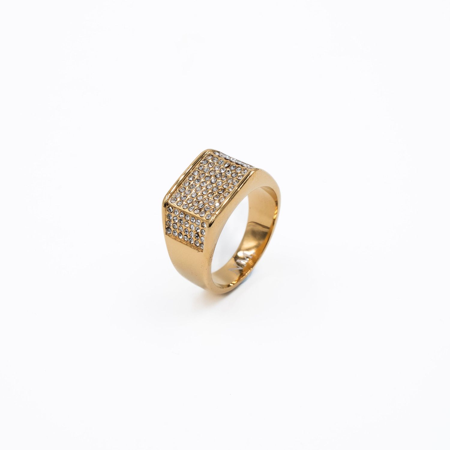 Gold signet ring with rectangular pavé diamond top setting shown on white background.