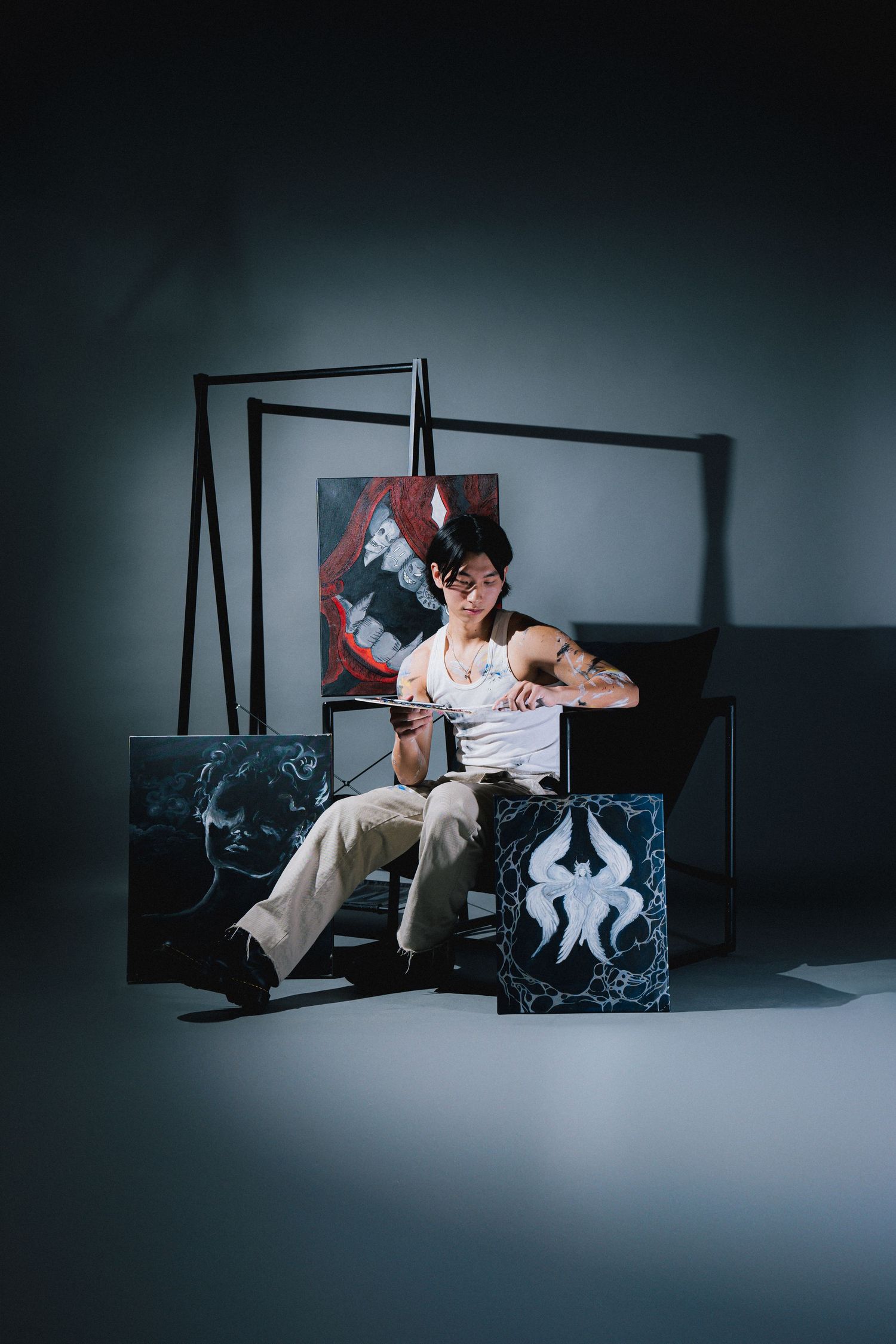A dramatic photo series showing someone sitting on a modern bench reading a book in moody lighting.