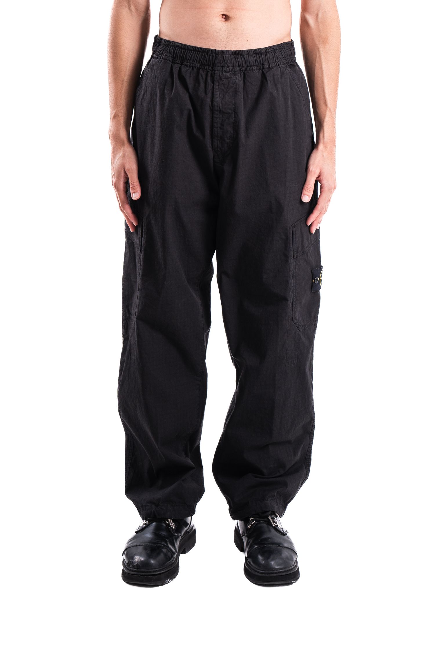 Black loose-fitting cargo pants with elastic waistband shown on model.