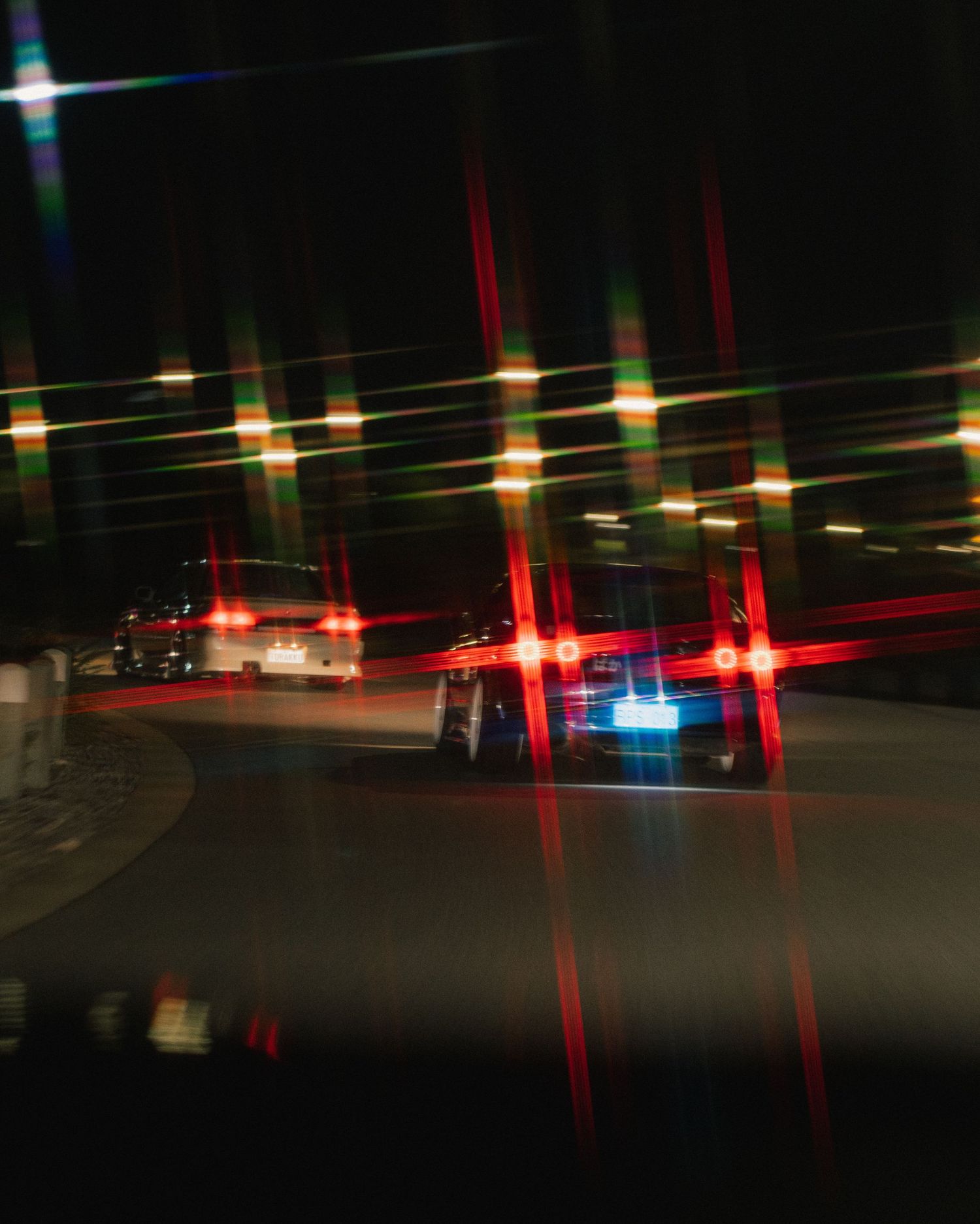 Abstract nighttime photography of car lights creating streaks and patterns.