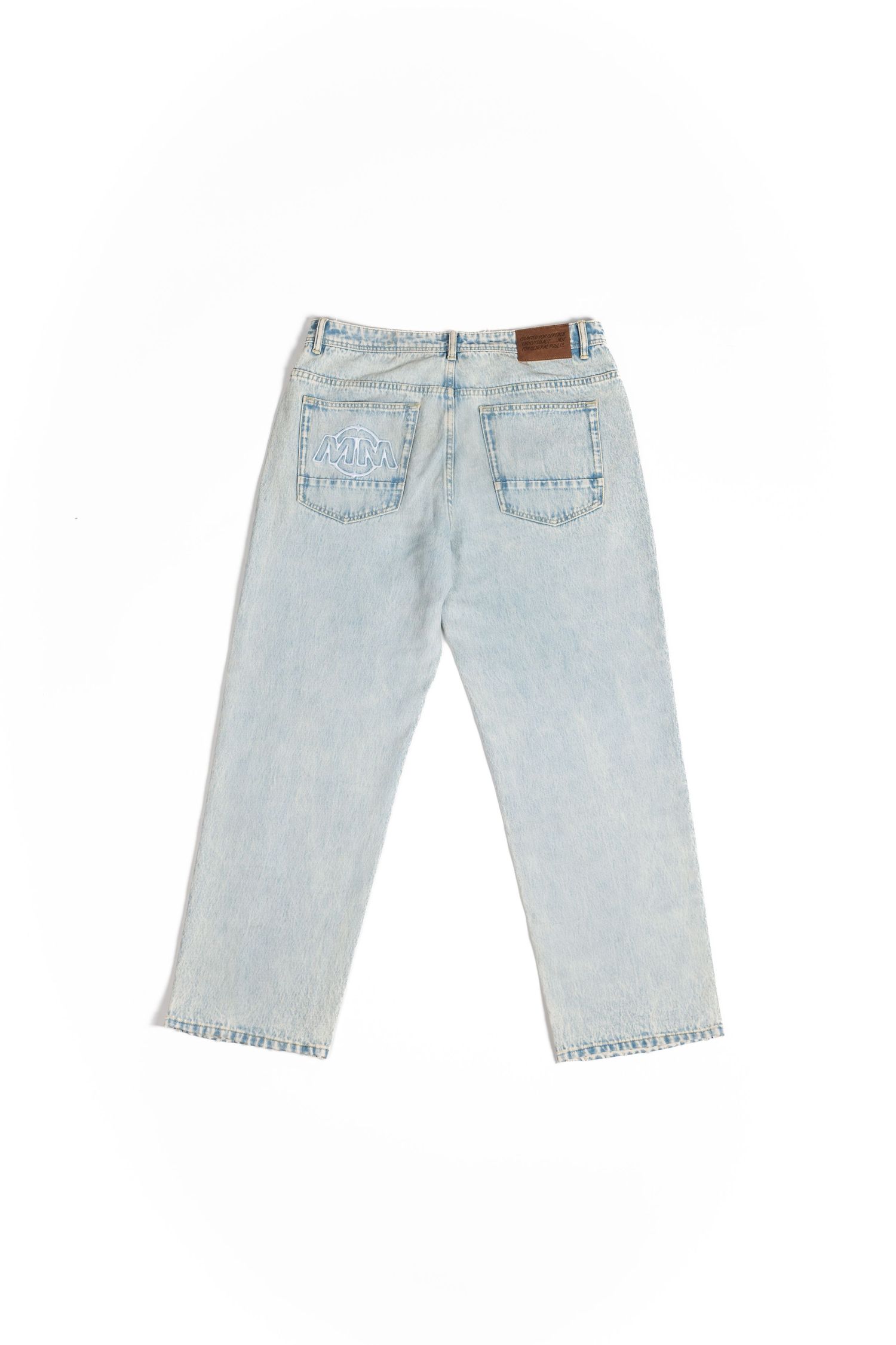 Light wash vintage-style jeans with back pockets and leather patch shown from behind.