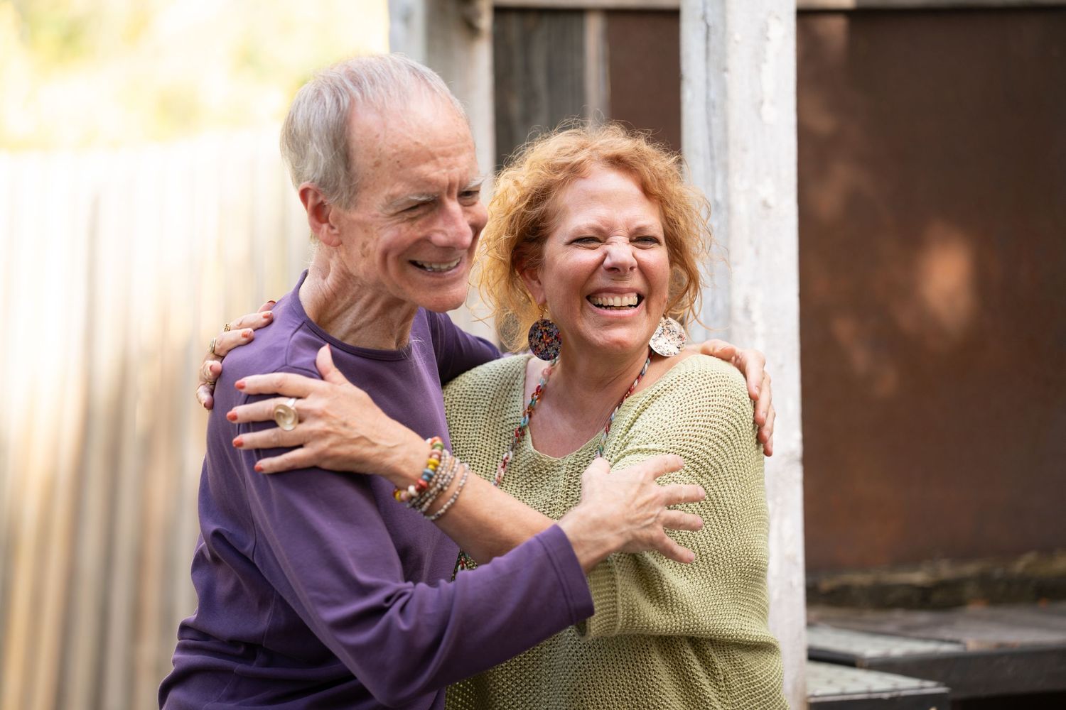 people smiling and embracing