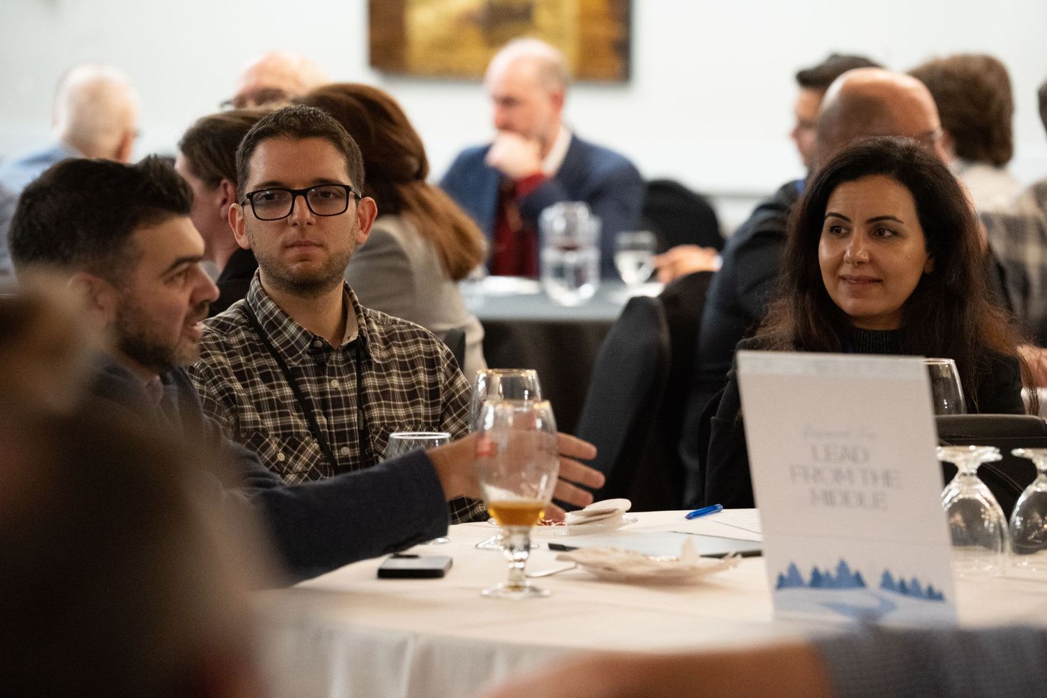 people smiling at a corporate event