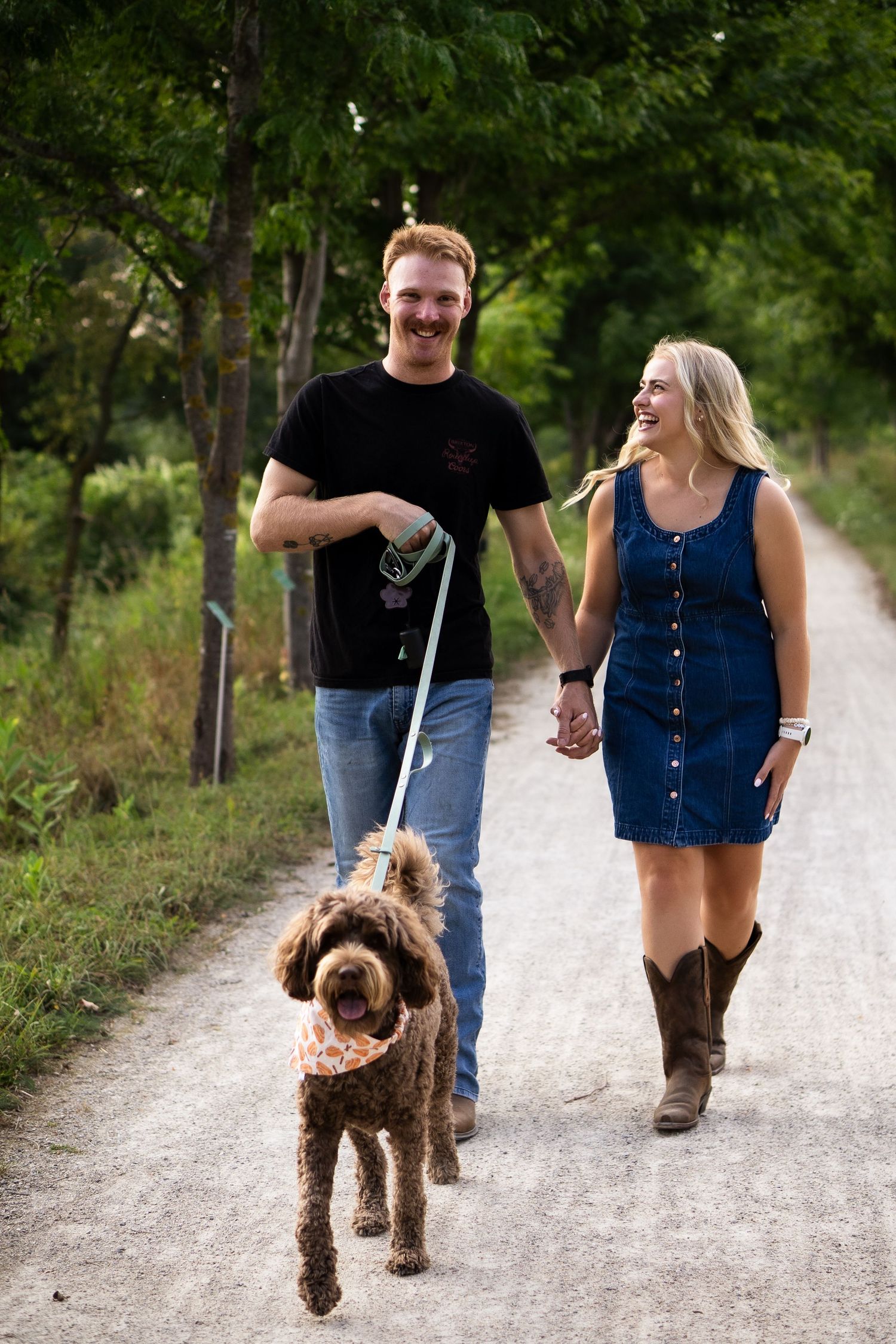 man and women walk dog