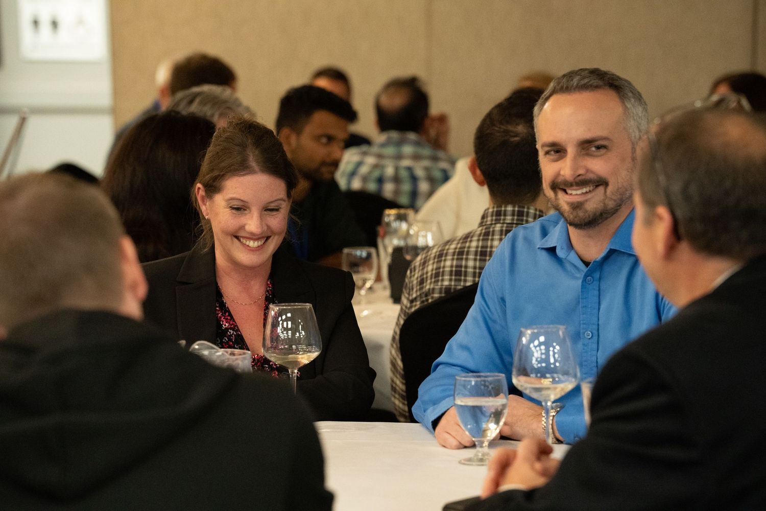 people smiling at corporate event