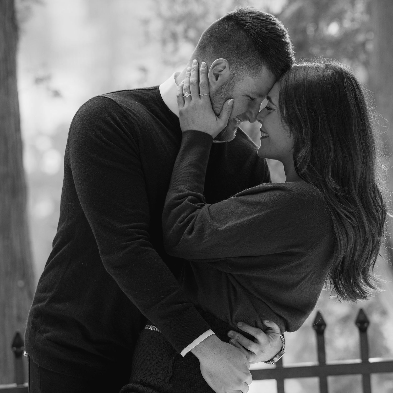 Man and women smile at each other while embracing