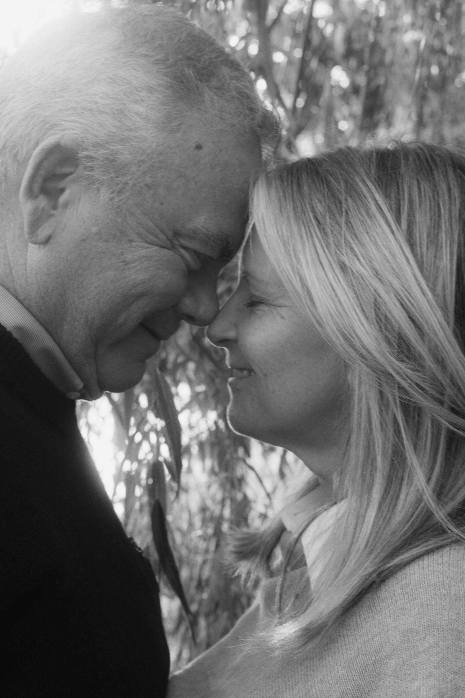 Intimate black and white portrait sequence showing tender moments.