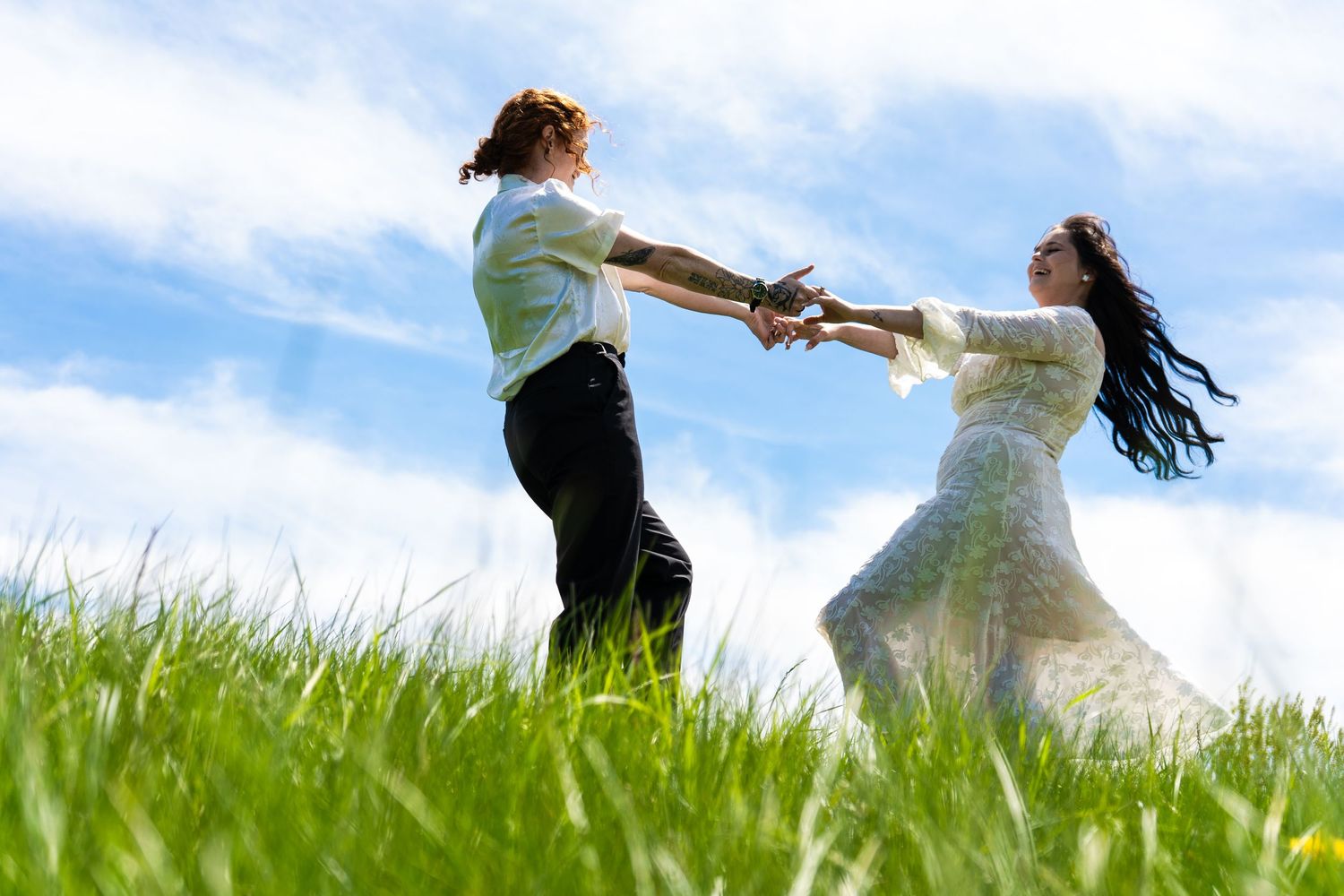 couple spin in grass field