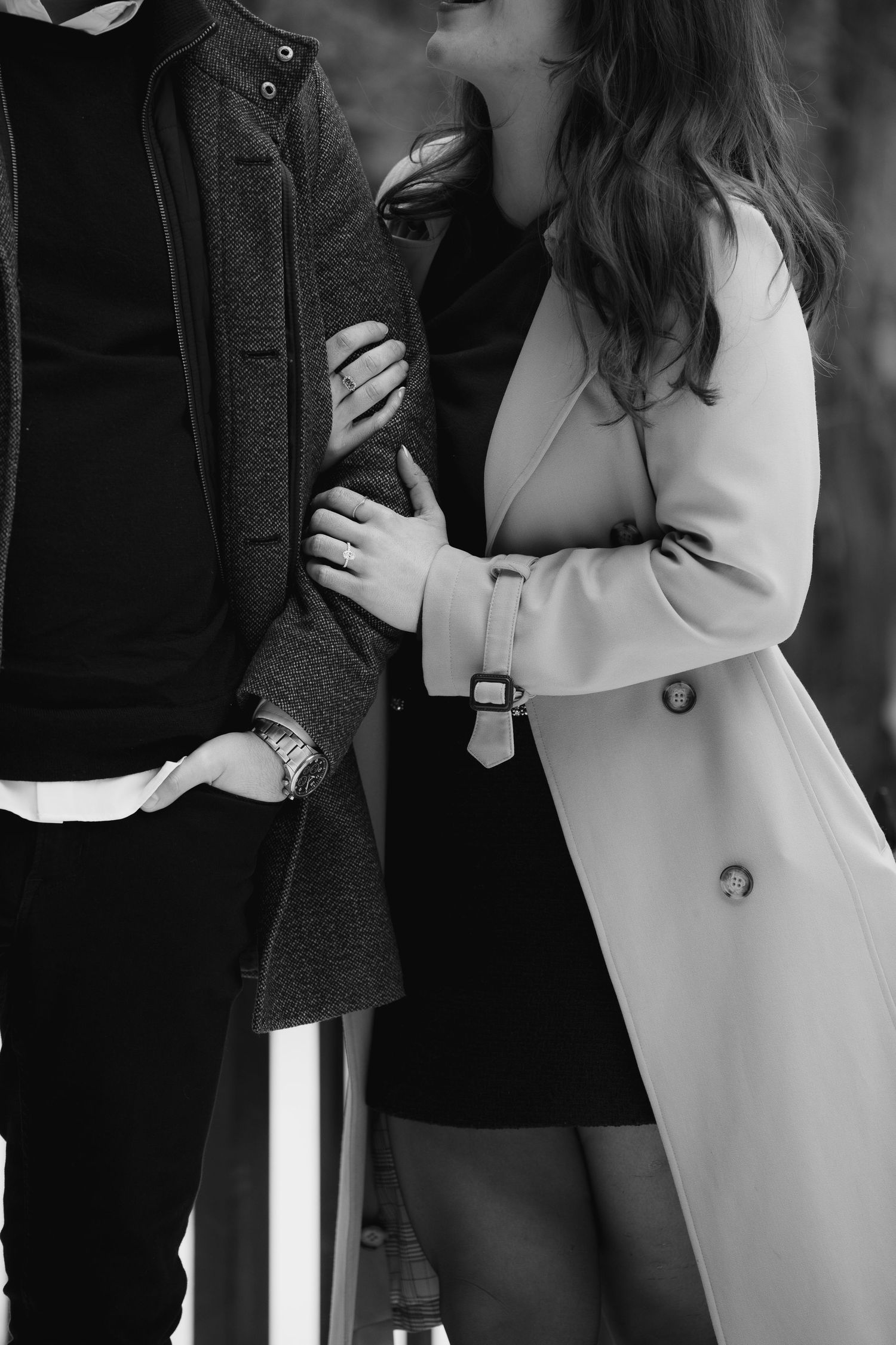 balck and white photos of women grasping mans arm