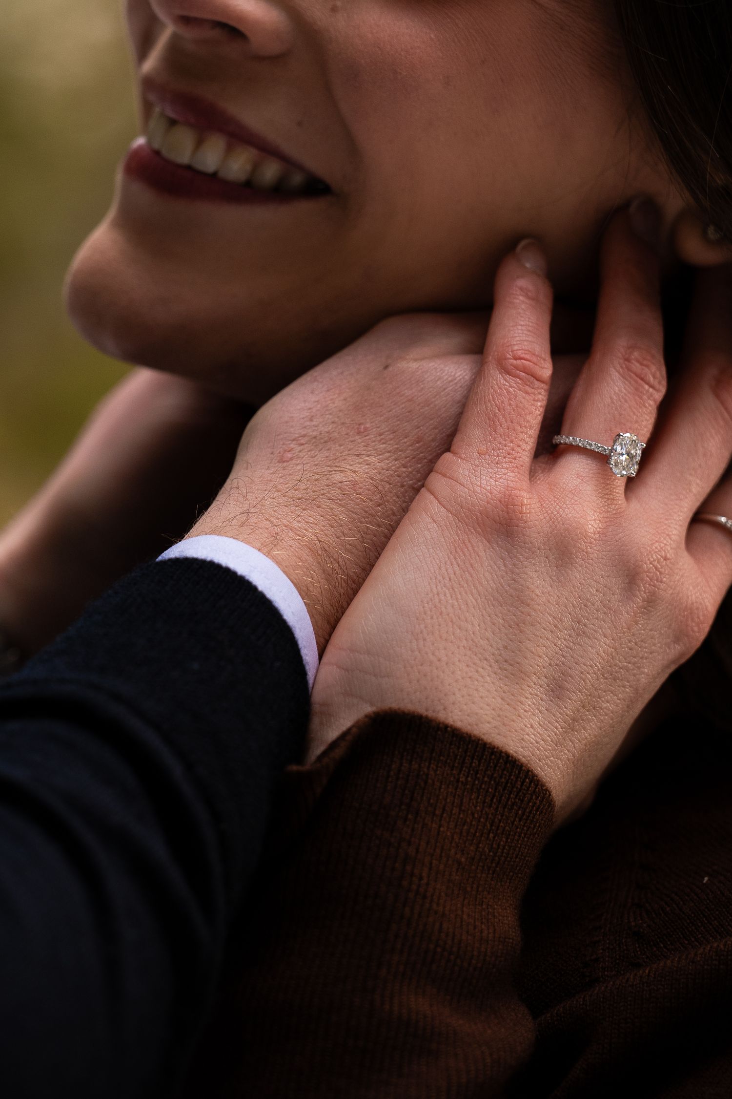 A close-up series showing hands with an engagement ring in different angles and poses against a dark background.