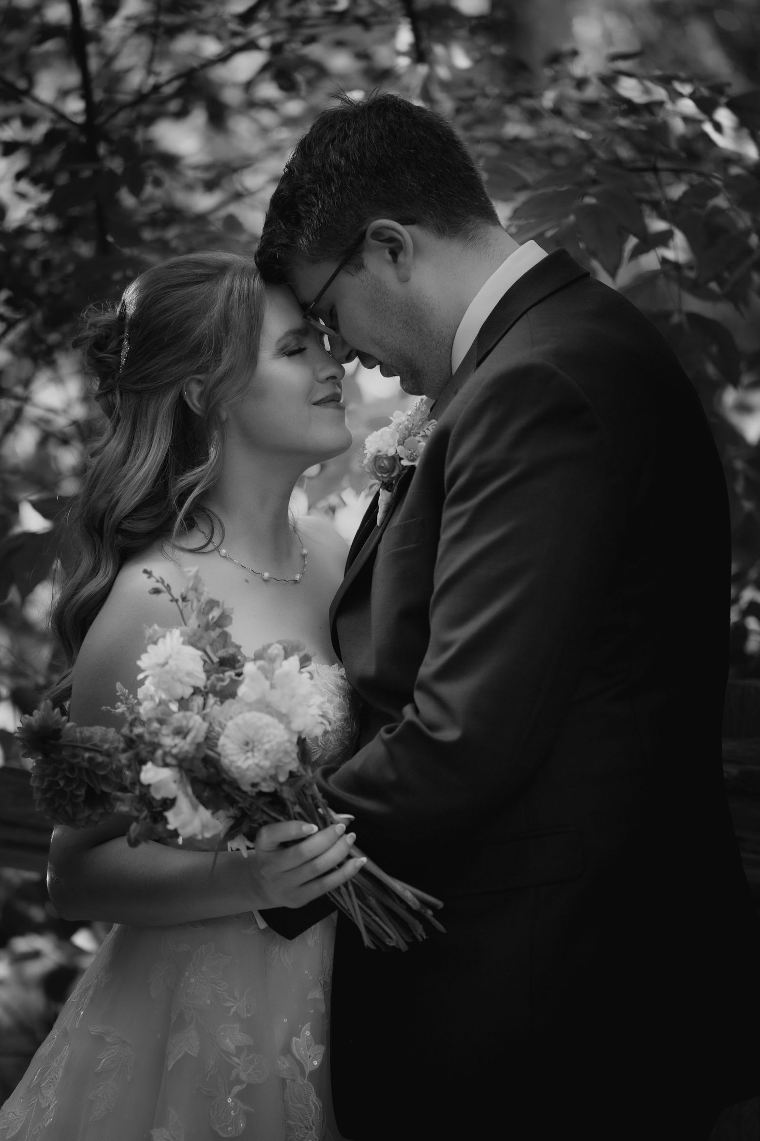 Black and white wedding sequence with bride holding a bouquet of flowers.