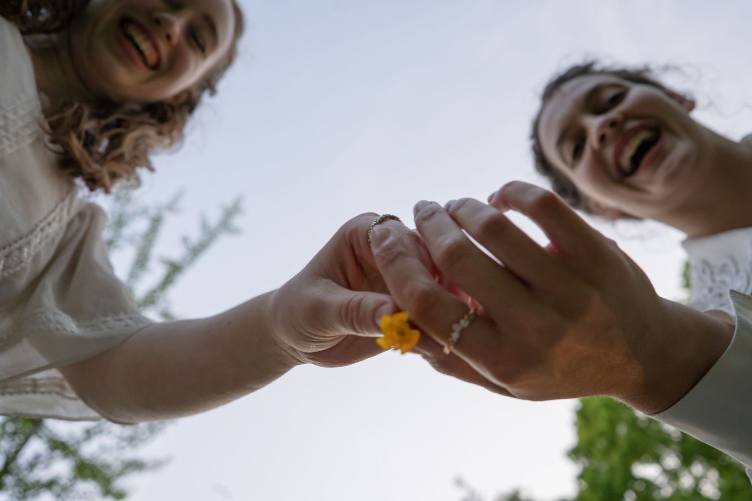 Close-up view of couple sharing intimate moments outdoors.