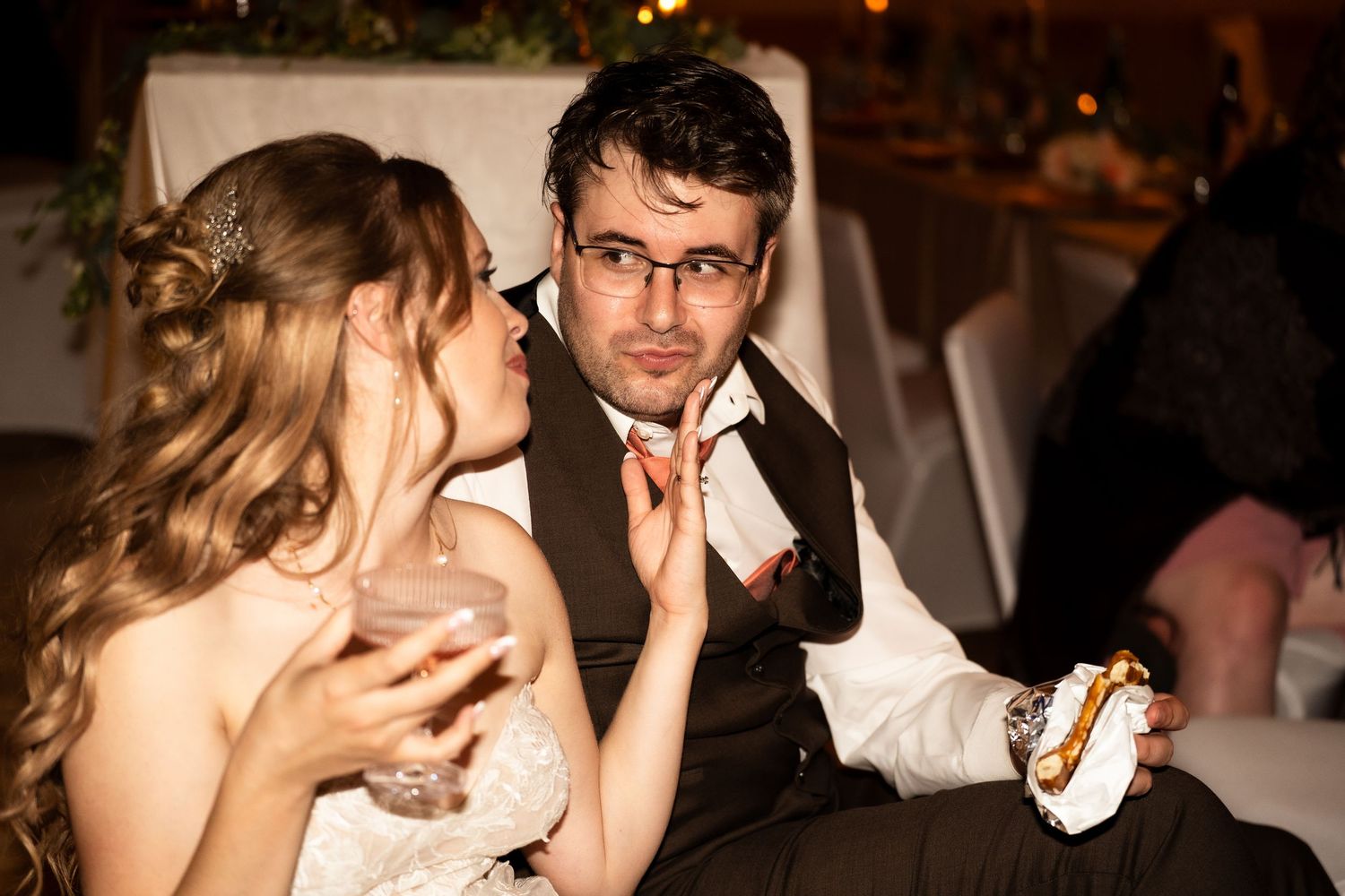 groom looks lovingly at his bride