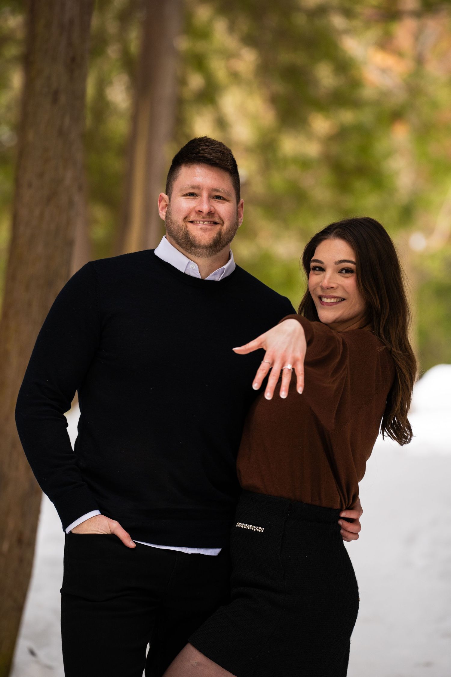 Men and women show off engagement rings.