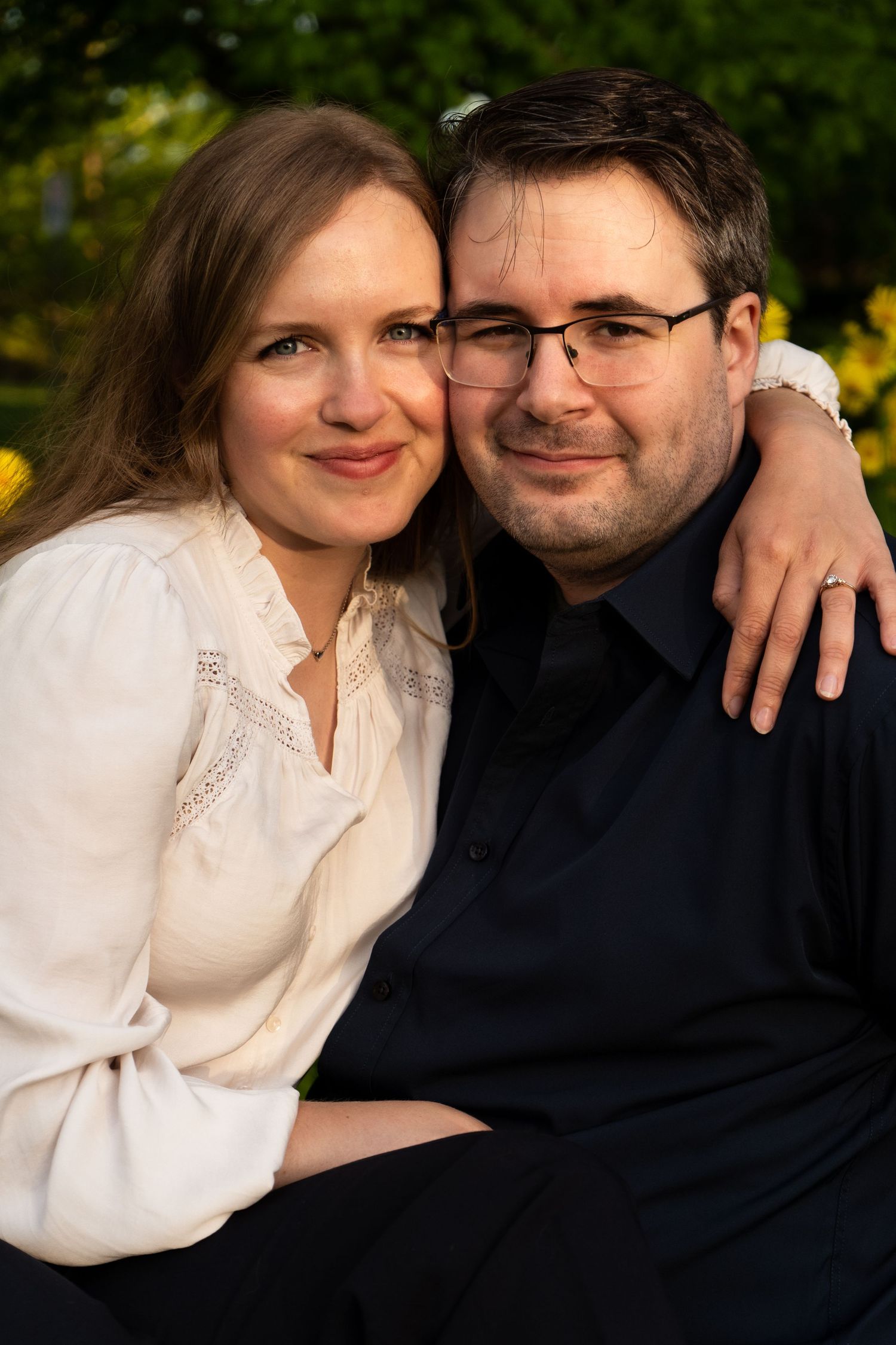Romantic couple portrait in a garden setting with soft natural lighting and intimate poses.