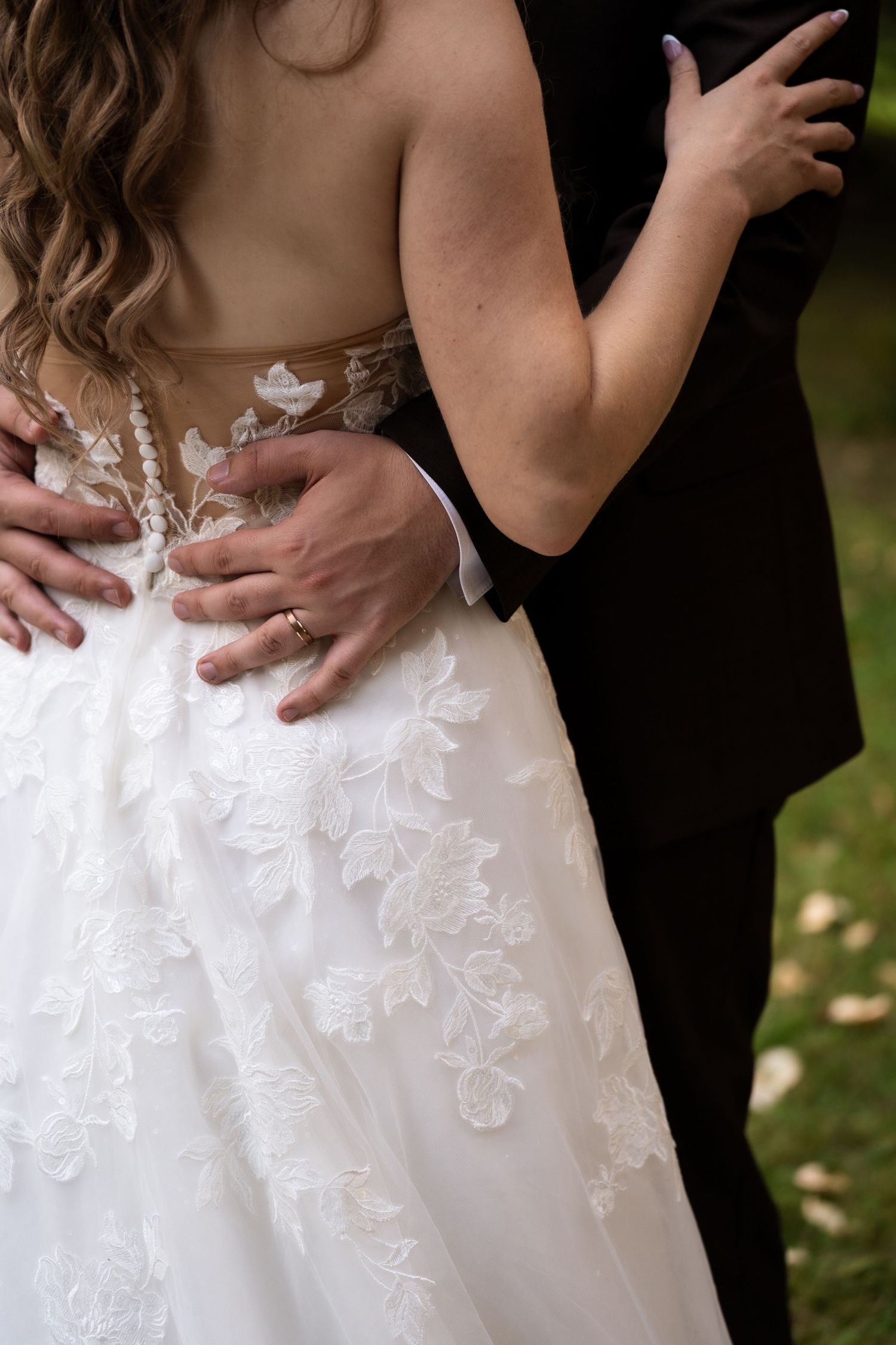 grooms hands on the bride's waiste