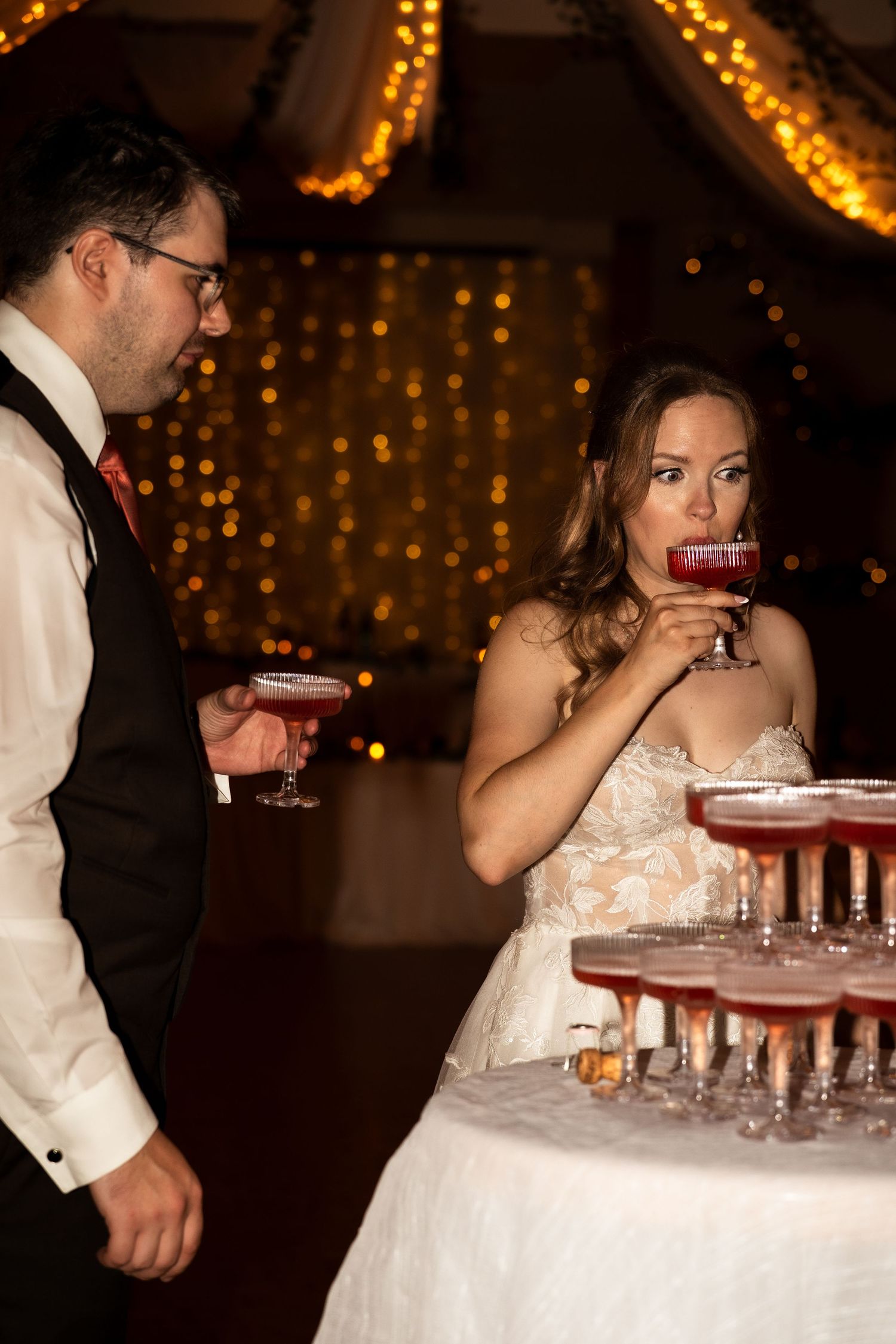 bride and groom drink champagne