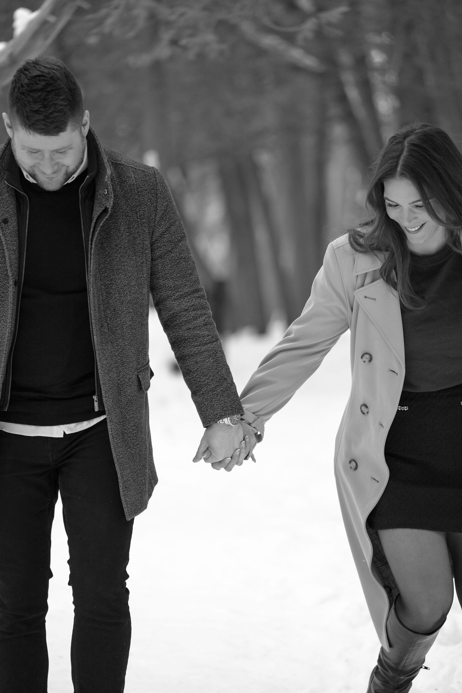 Black and White photo of man and women running together
