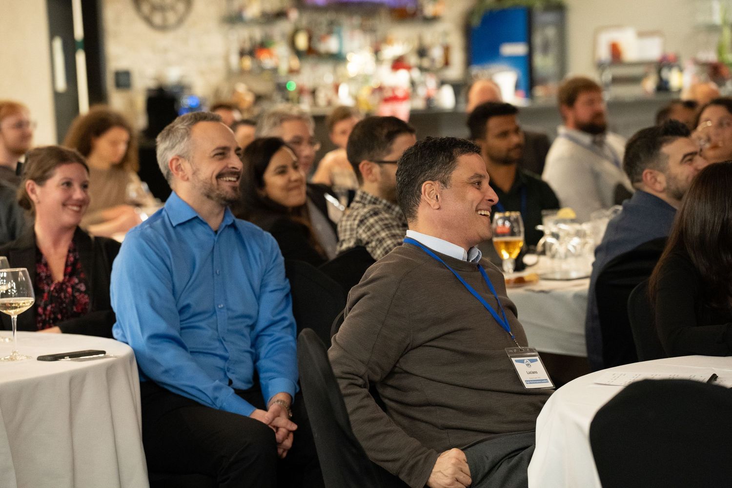 people smiling at a corporate event