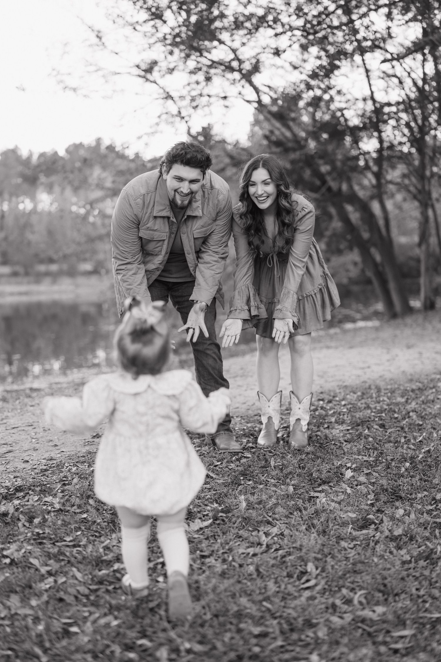 Black and white photo sequence showing couple encouraging toddler to walk towards them in autumn park setting.