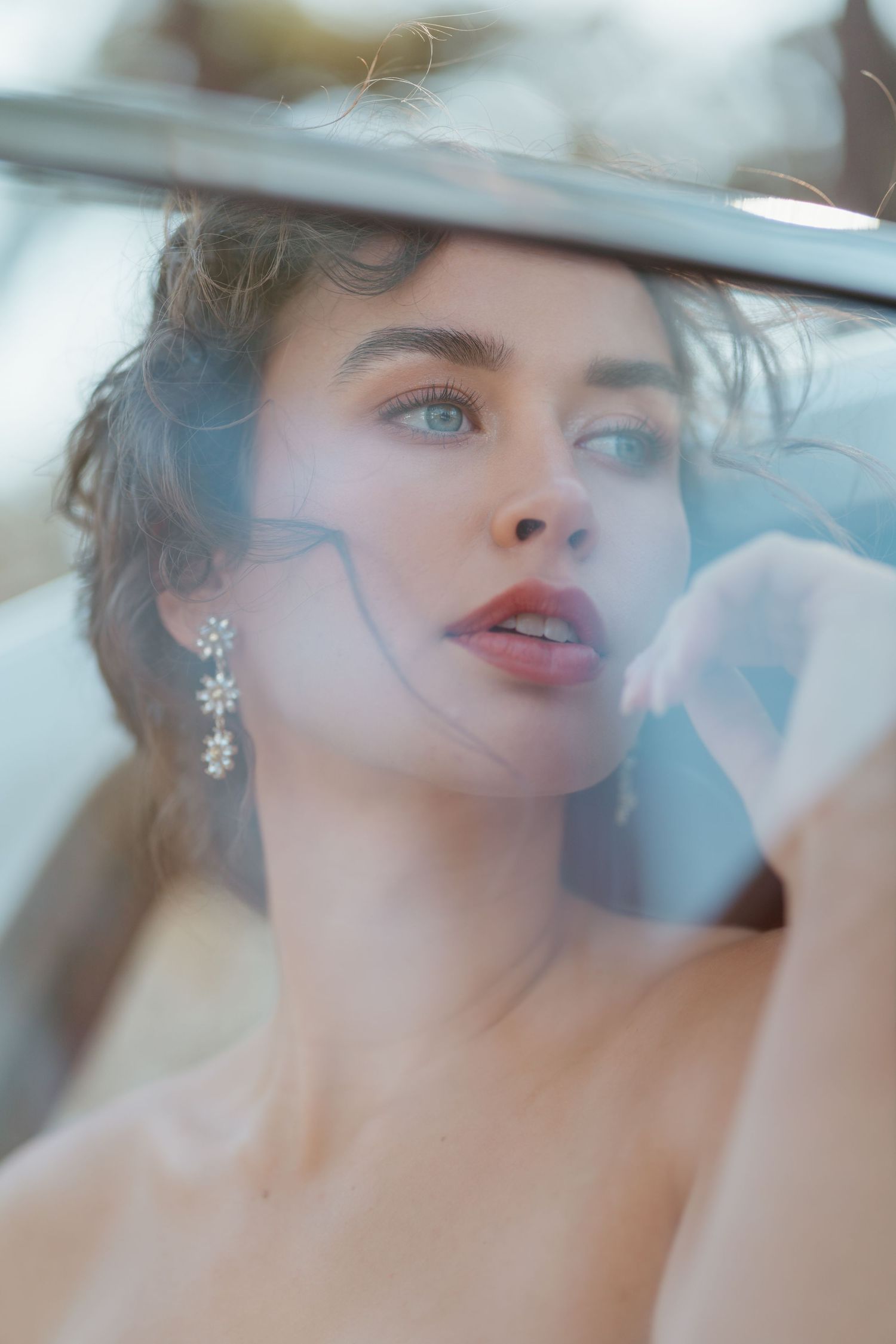 Artistic fashion portrait series showing ethereal close-up shots with soft lighting and dreamy atmosphere.