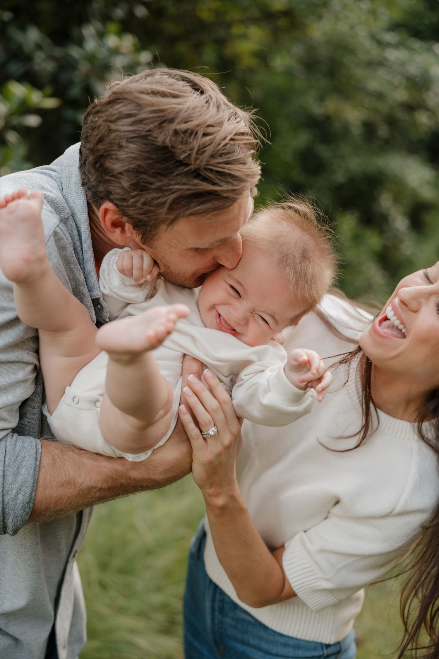 A romantic sequence of candid moments showing a couple embracing and laughing together outdoors.