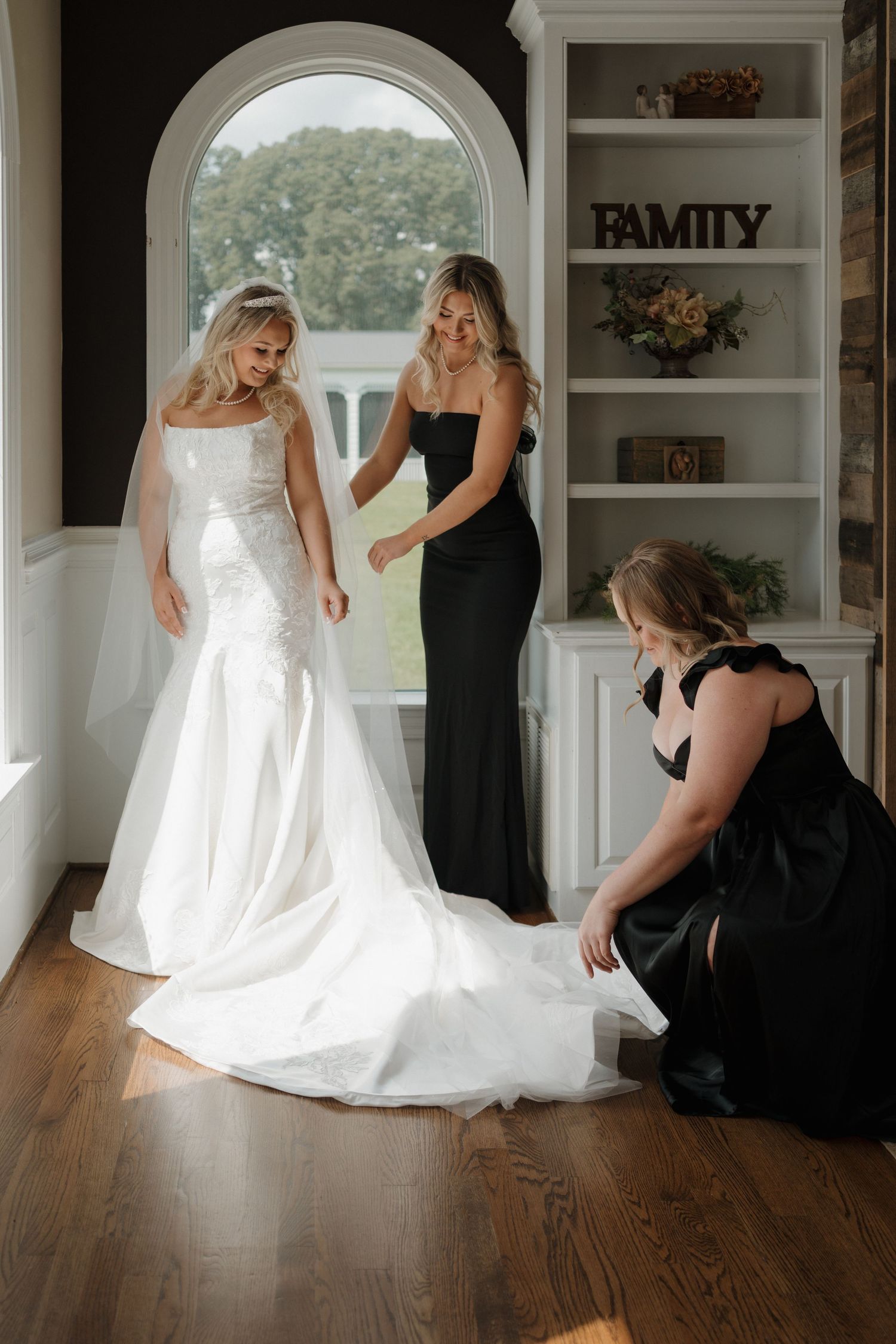 A bridal preparation sequence shows the final touches being made to a white wedding dress in a bright interior room.