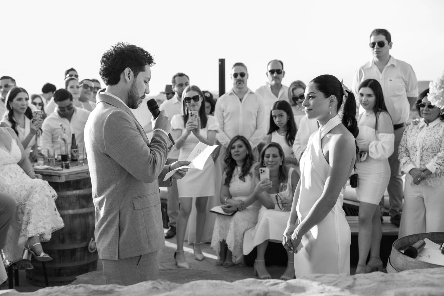 A black and white panoramic photo showing a crowd of people gathered together at a celebratory event.
