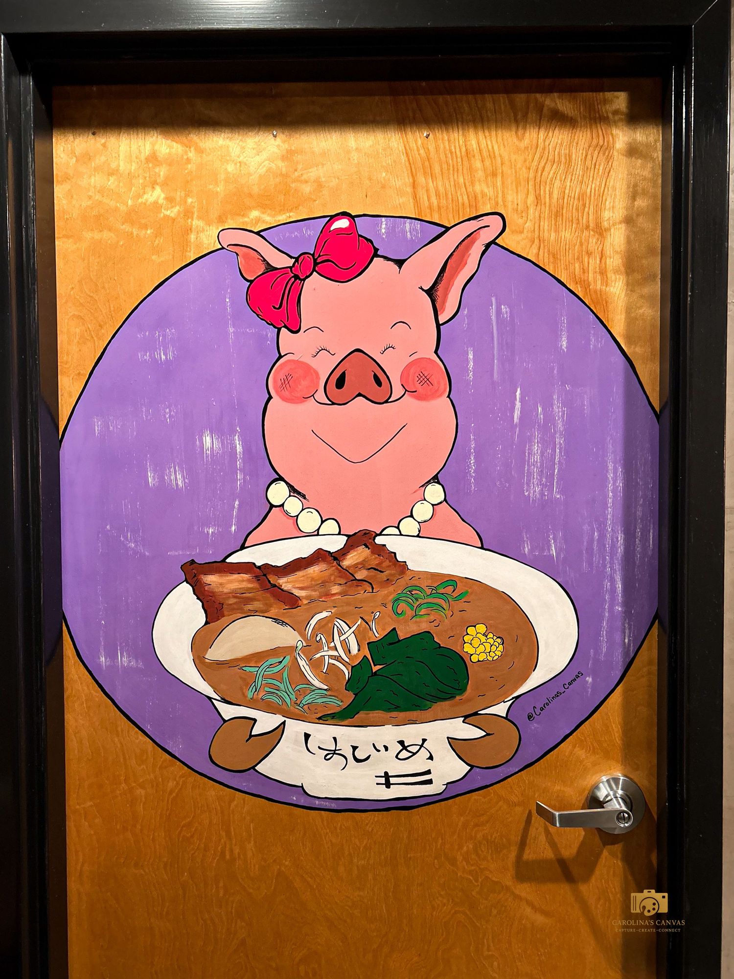 A series of cartoon pig illustrations mounted on a wall show different plates of food with a purple background.