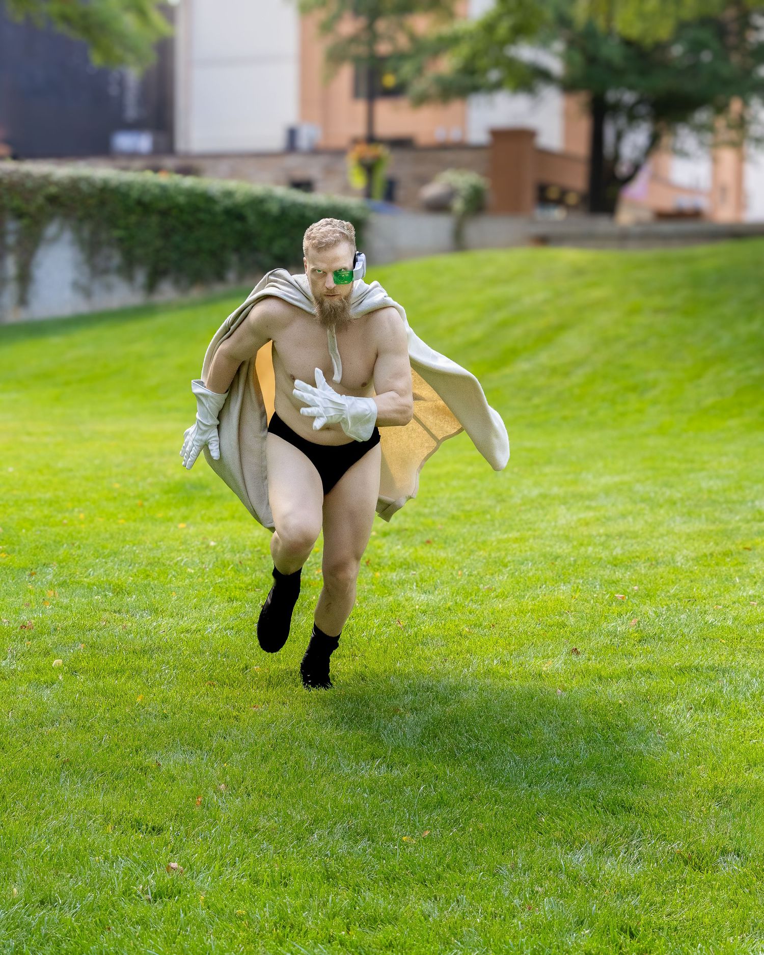 A sequence of four action shots showing someone jumping and flipping on a grassy lawn in a beige outfit.