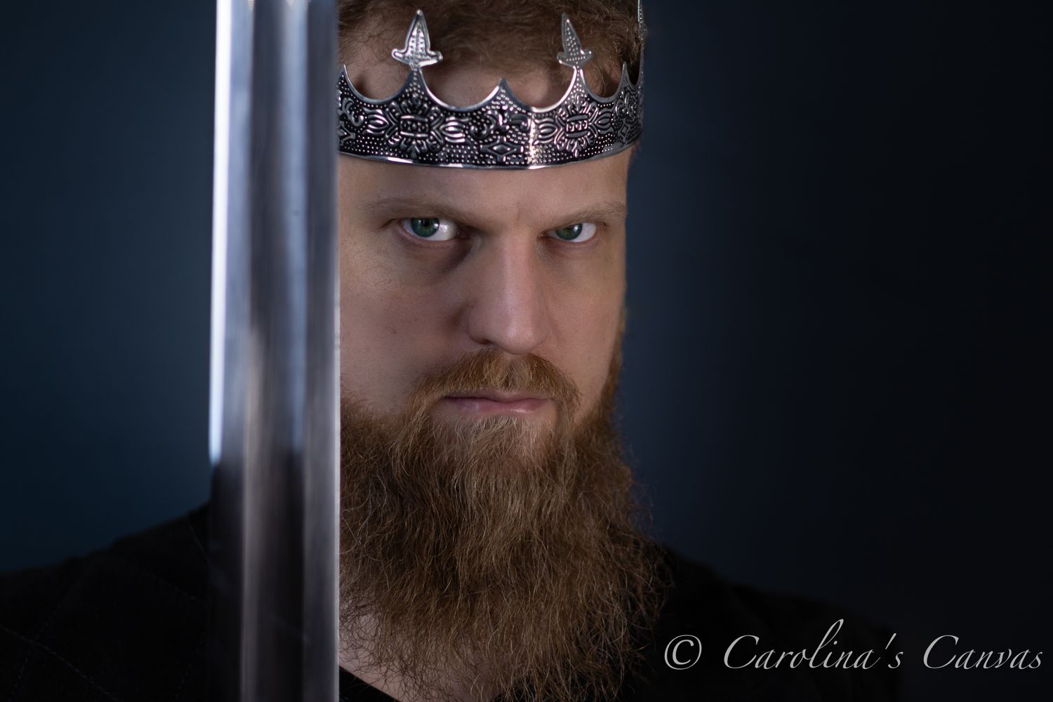 Photography studio lighting setup shows dramatic portrait triptych with shadowed figure wearing a crown against dark background.