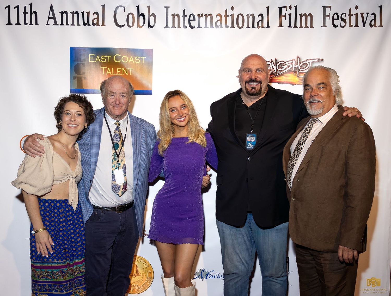 Group photo from the 11th Annual Cobb International Film Festival with attendees posing together.