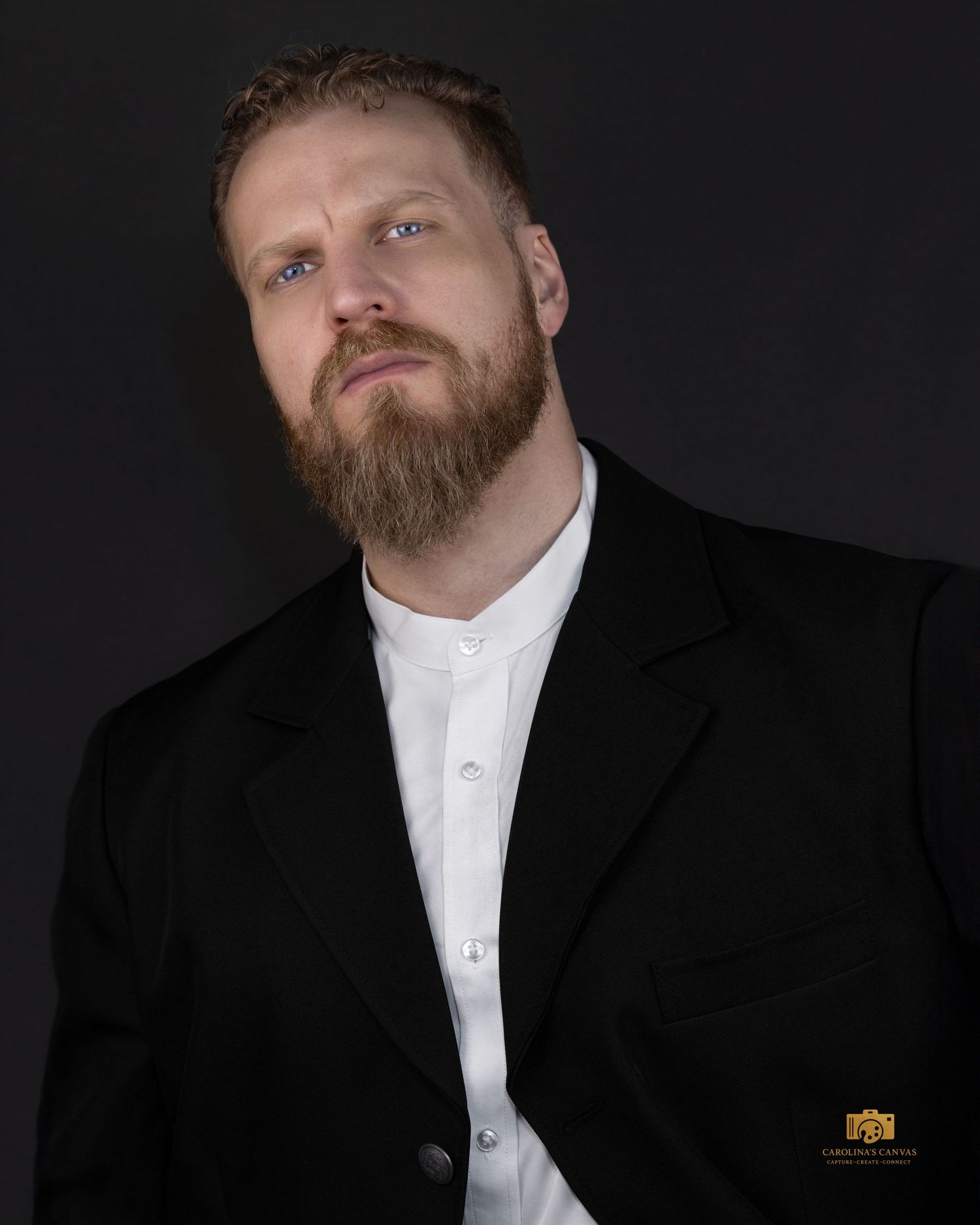 A series of black and white studio portraits showing someone in a black suit and white shirt against a dark background. headshot