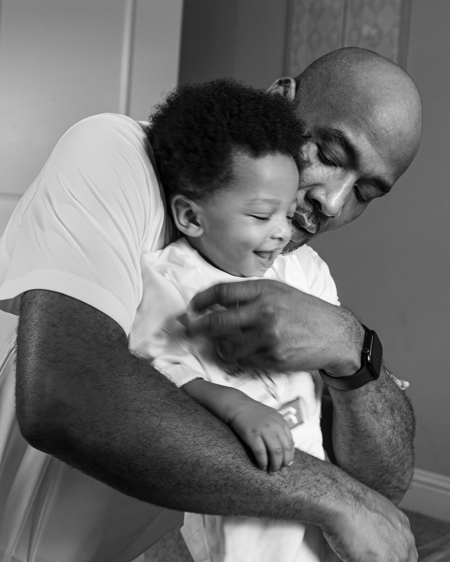 Series of emotional black and white photographs showing loving family embrace.
