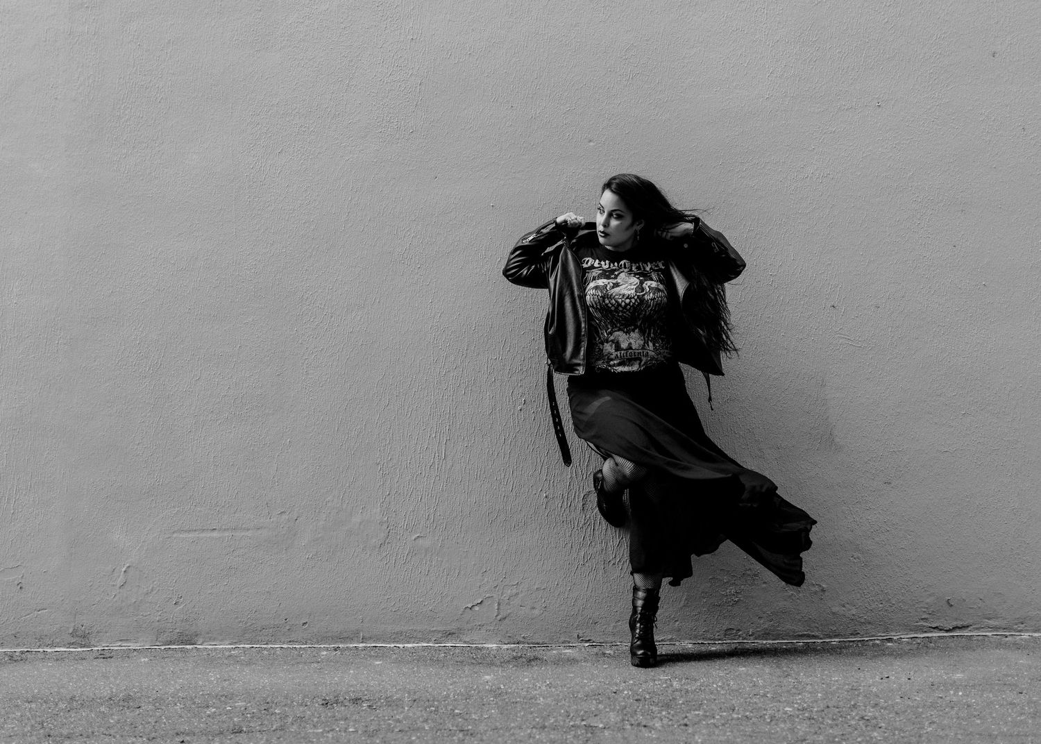 A series of black and white photographs showing silhouettes of people sitting against a wall in various poses.