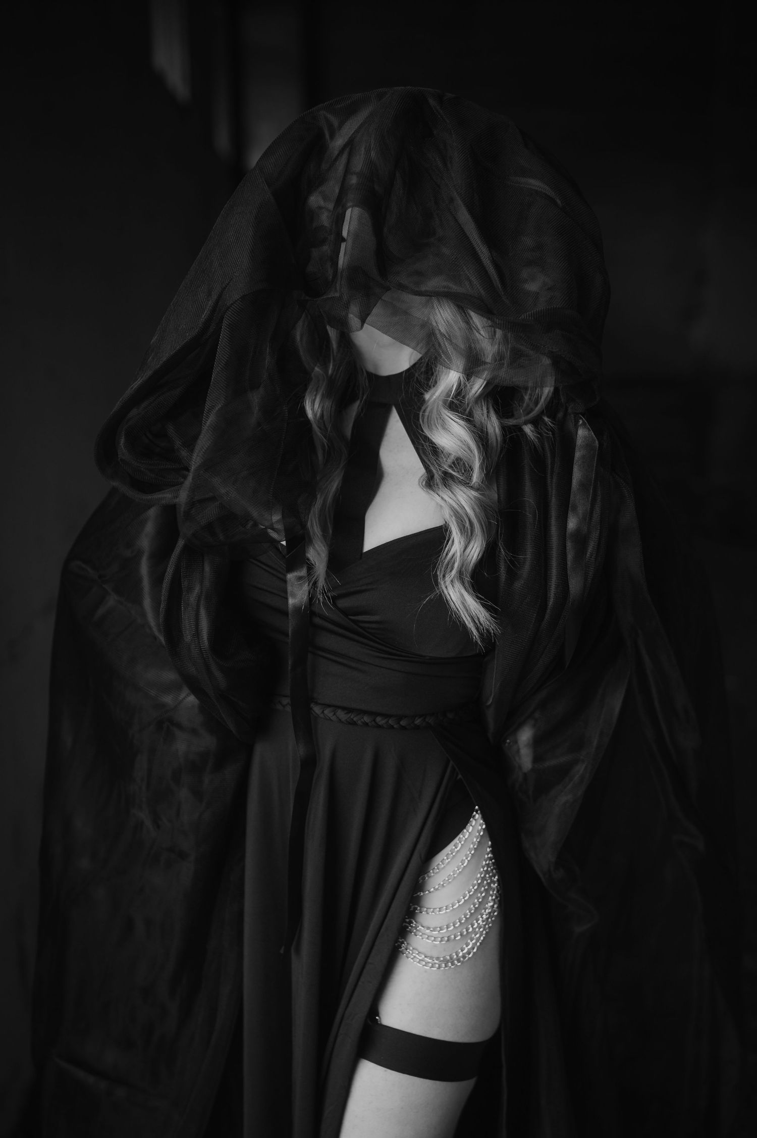 Black and white photo series showing a woman wearing black lingerie in moody dramatic lighting.