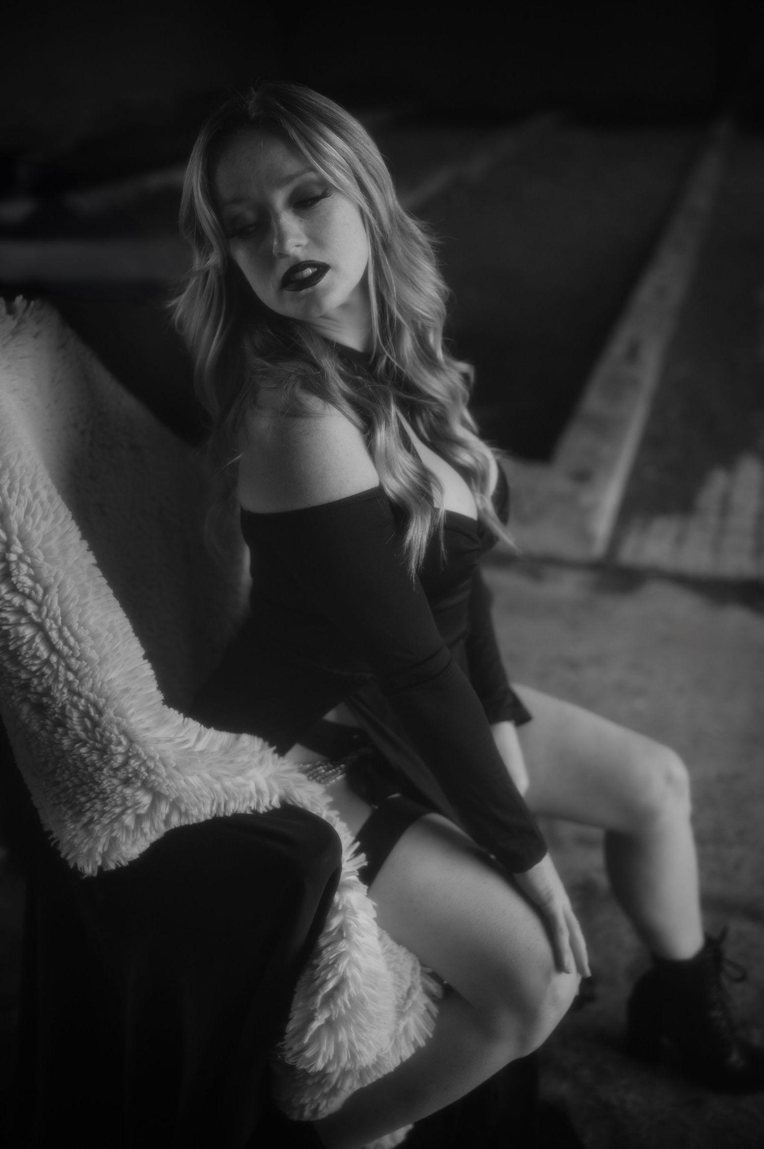 A series of black and white artistic portraits showing a contemplative figure in a relaxed indoor setting.