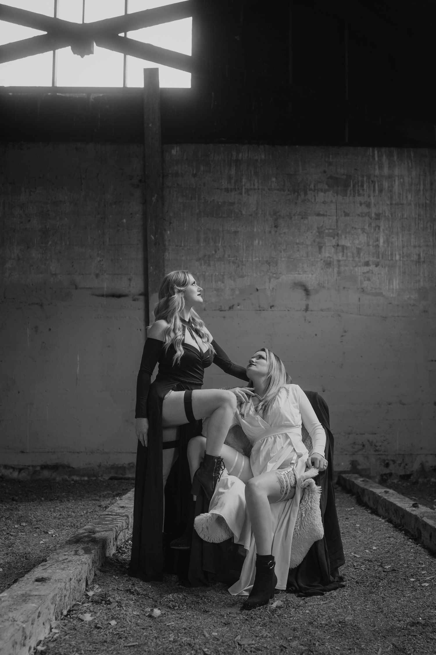 A black and white artistic photo series showing two people sitting on chairs in a stark, minimalist setting.