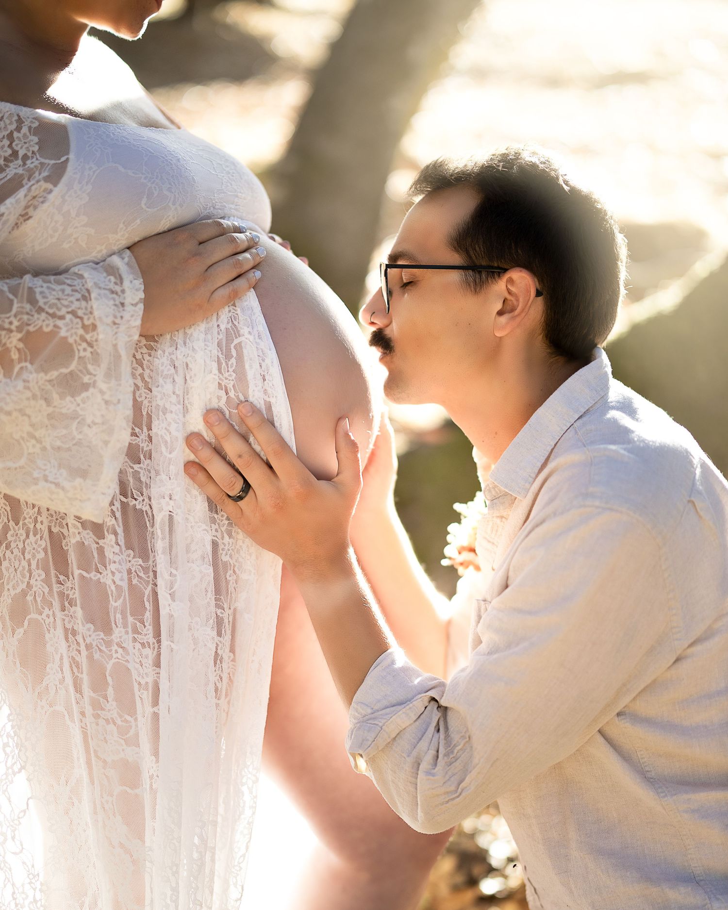 A romantic wedding couple sharing intimate moments in soft sunlit portraits.