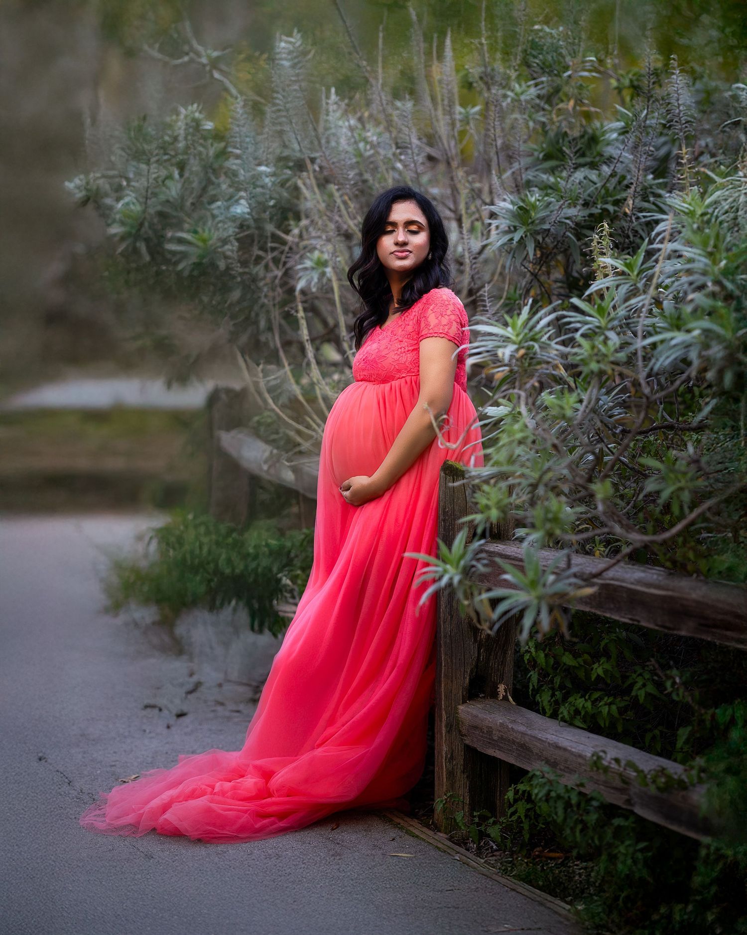 A series of photos showing a flowing coral-colored gown against a natural garden backdrop.